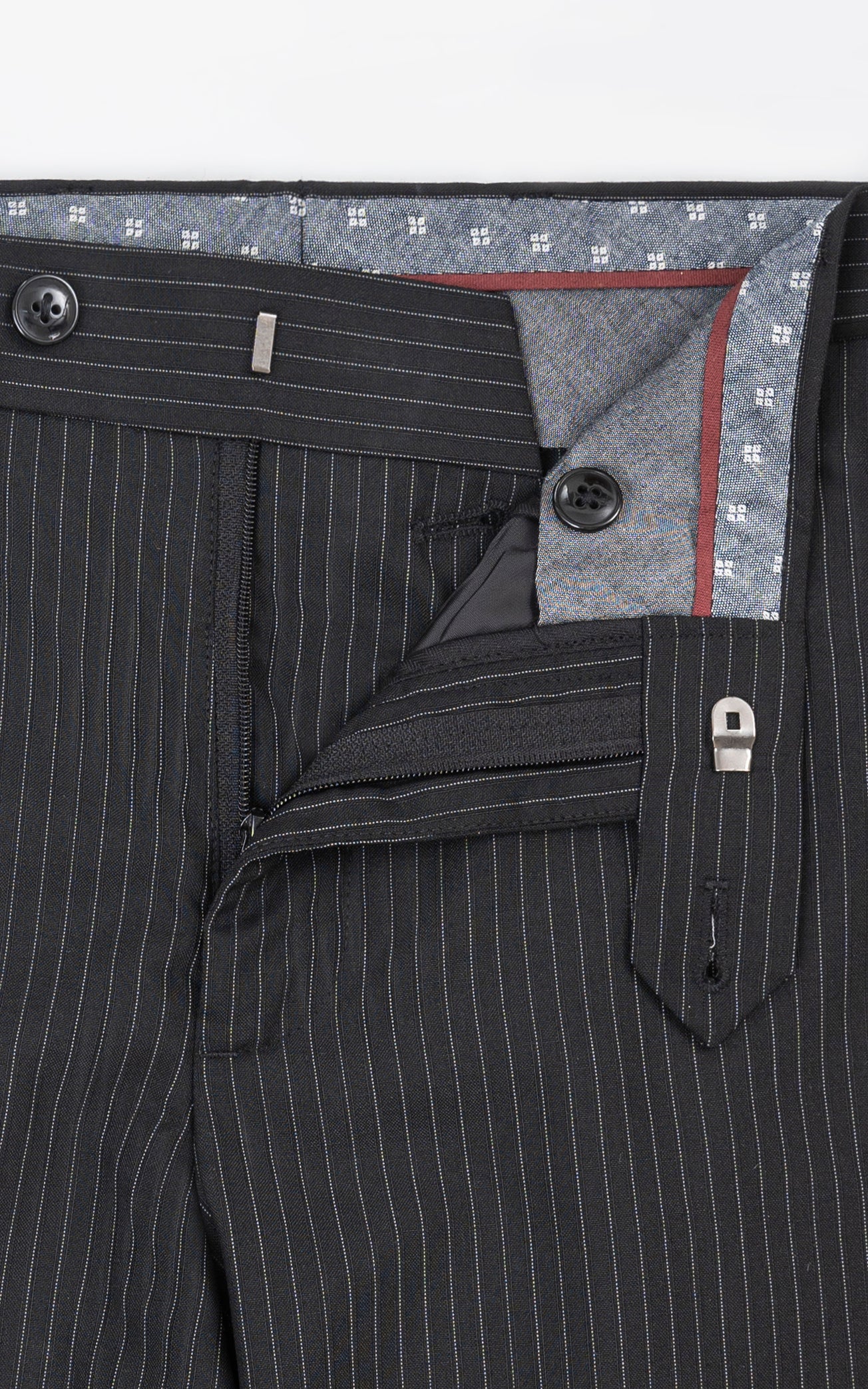 Black pinstripe dress pants inner waistband and button placket detail