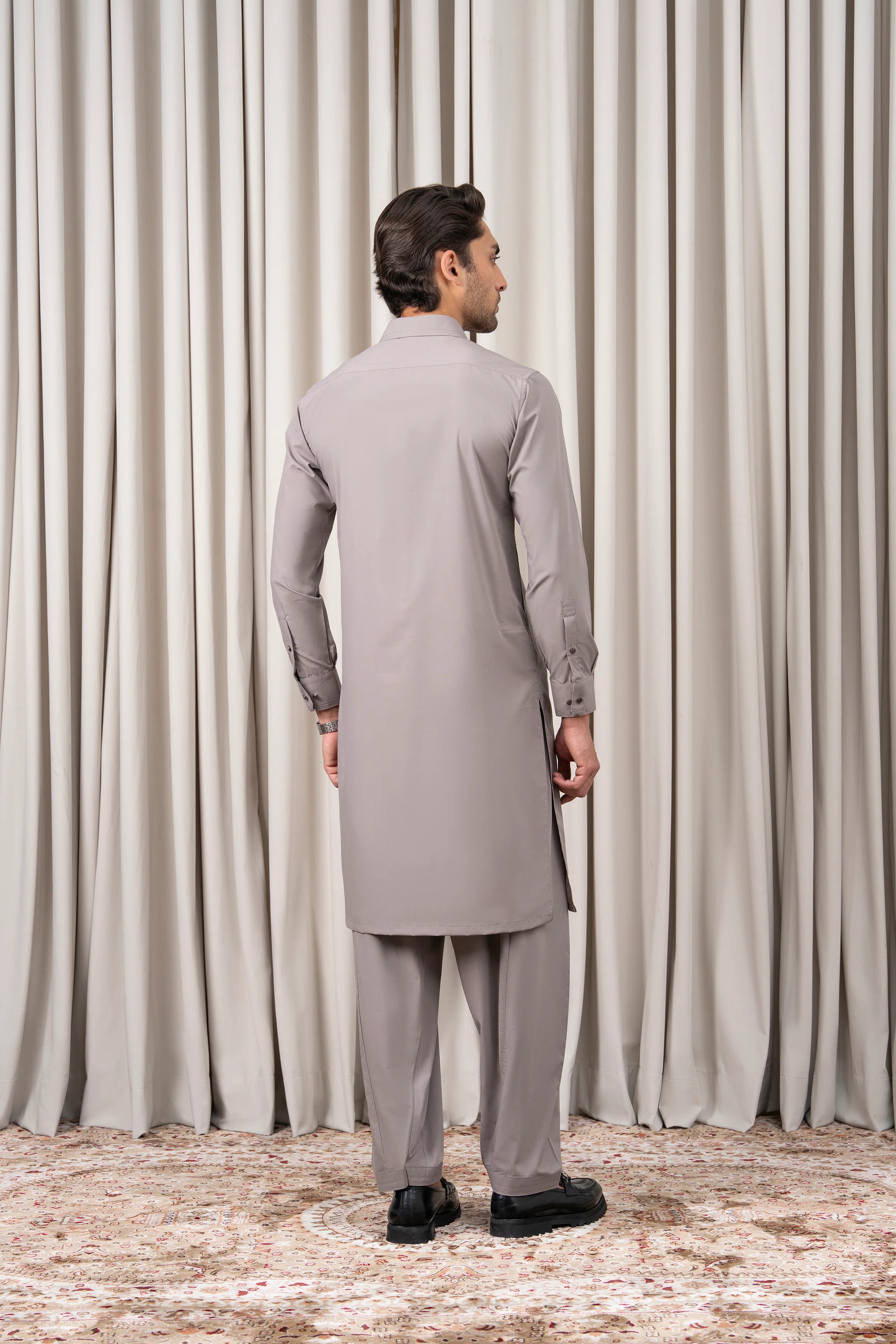 Light grey kameez and shalwar set, back view with long sleeves and matching pants