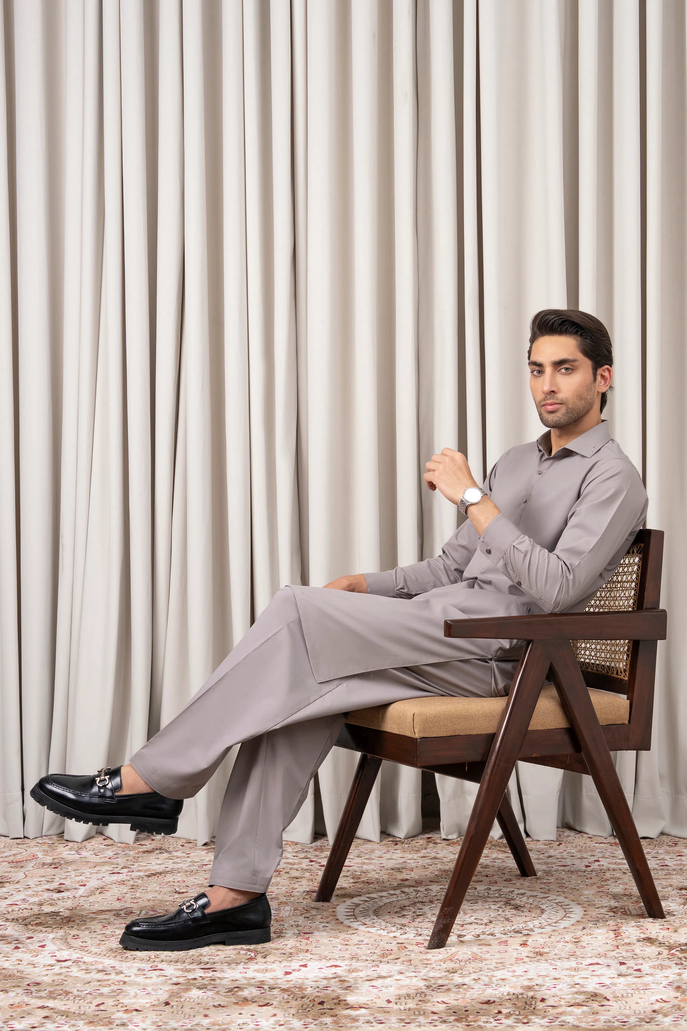 Light grey kameez and shalwar set, seated pose showing drape and matching trousers