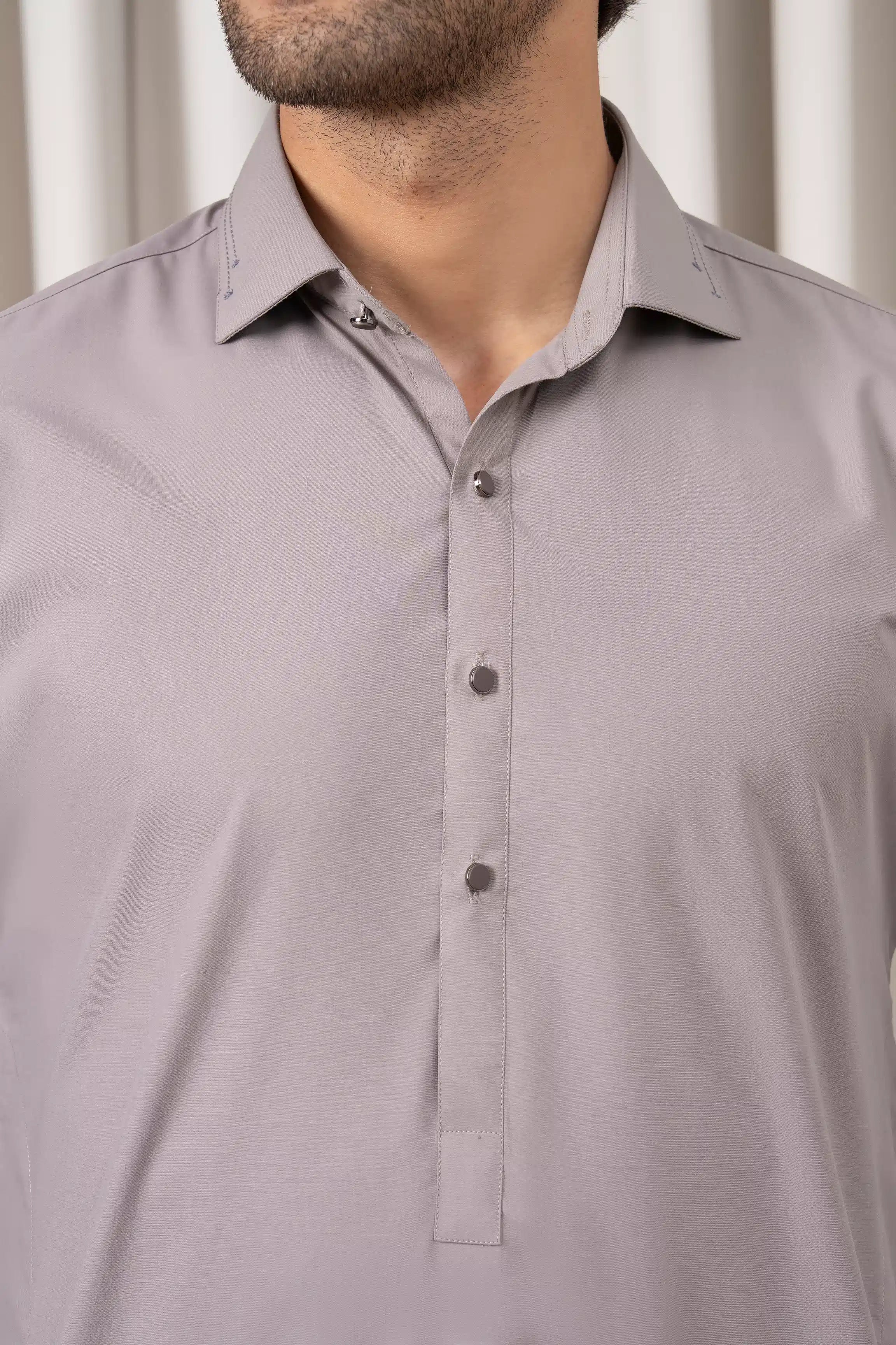 Light grey kameez collar with button front and folded neckline, close-up