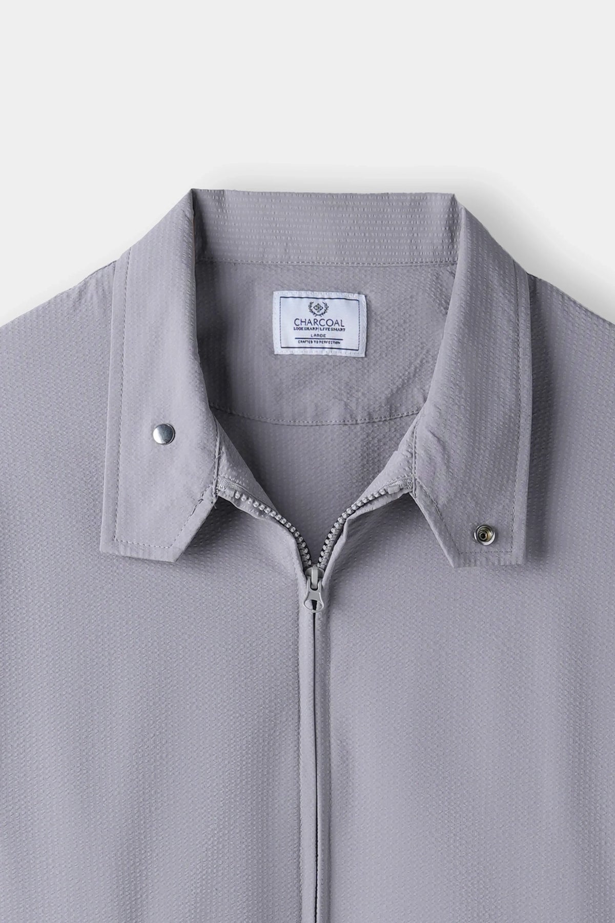 Light grey seersucker jacket collar with zip front and CHARCOAL logo label