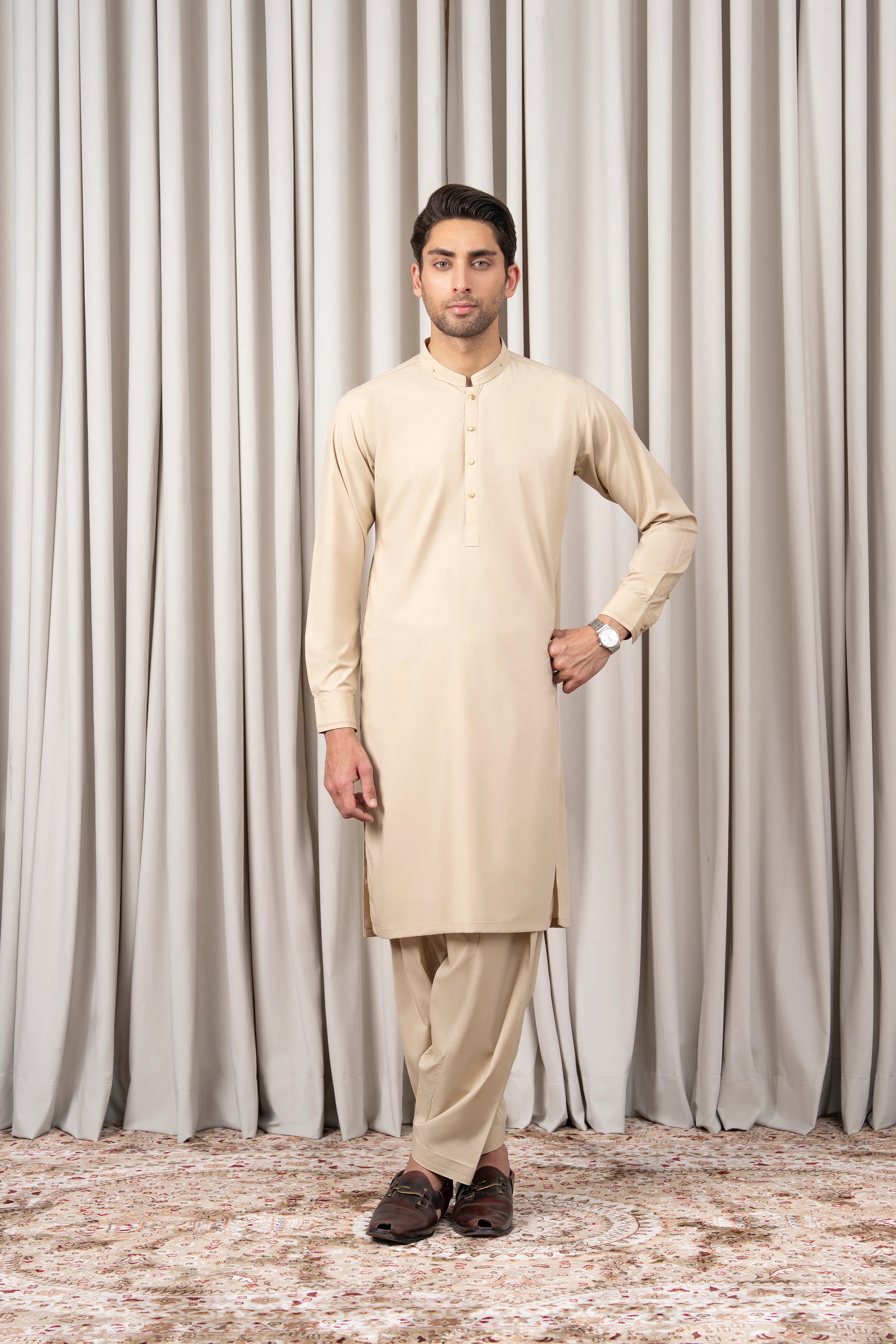 Beige kurta kameez and shalwar set, long sleeves and gold button front