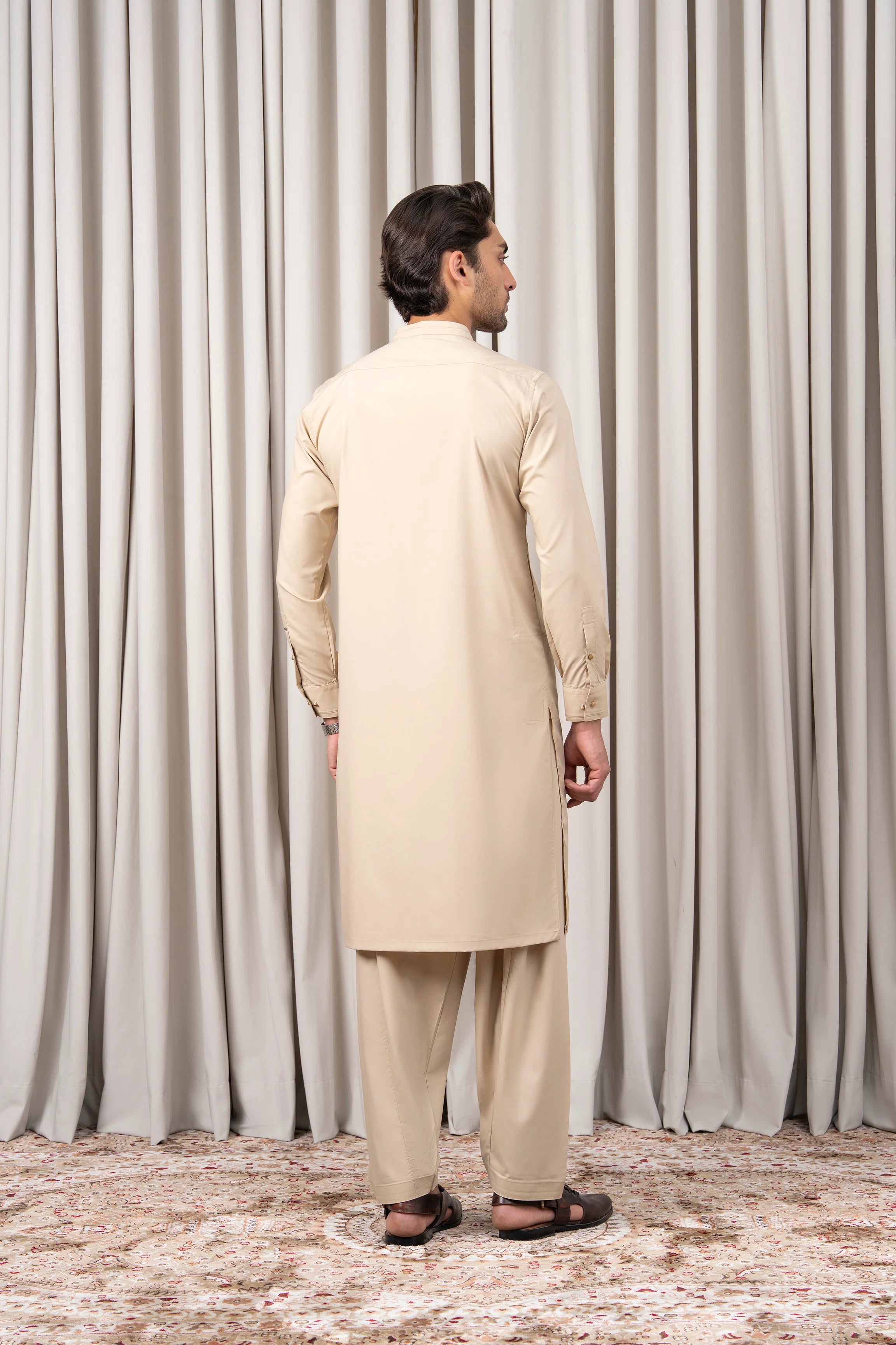 Beige kameez and shalwar set, back view with long sleeves
