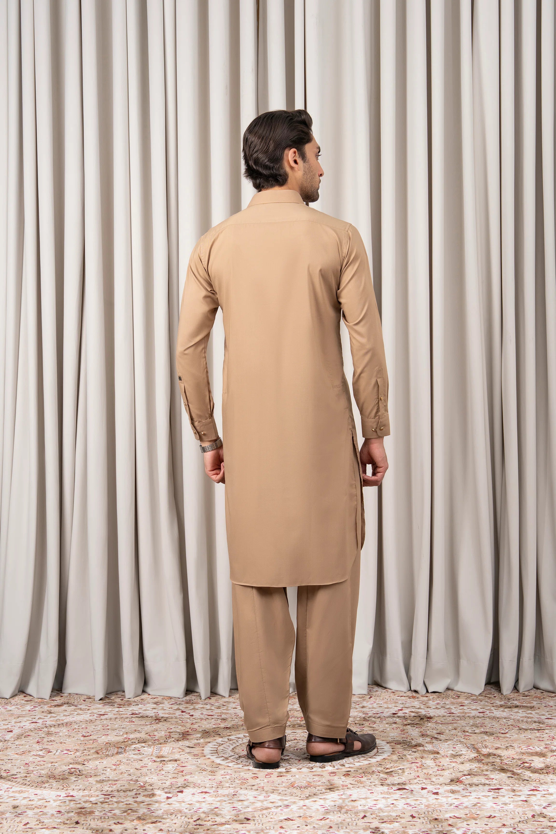 Khaki kameez shalwar set, back view of long tunic and shalwar pants