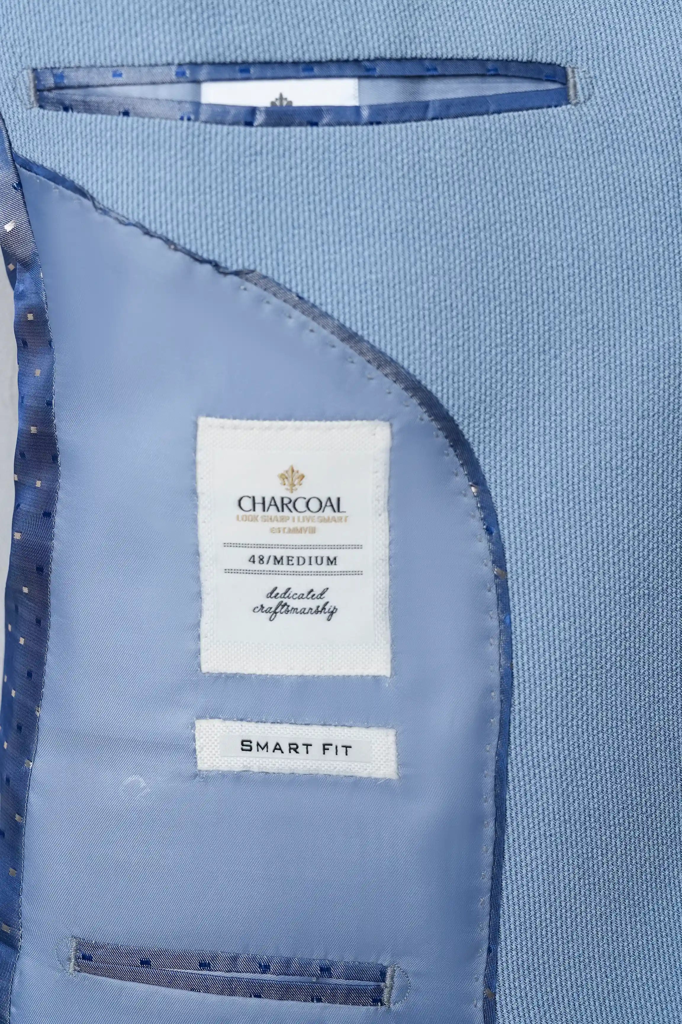 Sky blue coat interior labels: Charcoal 48/Medium, smart fit