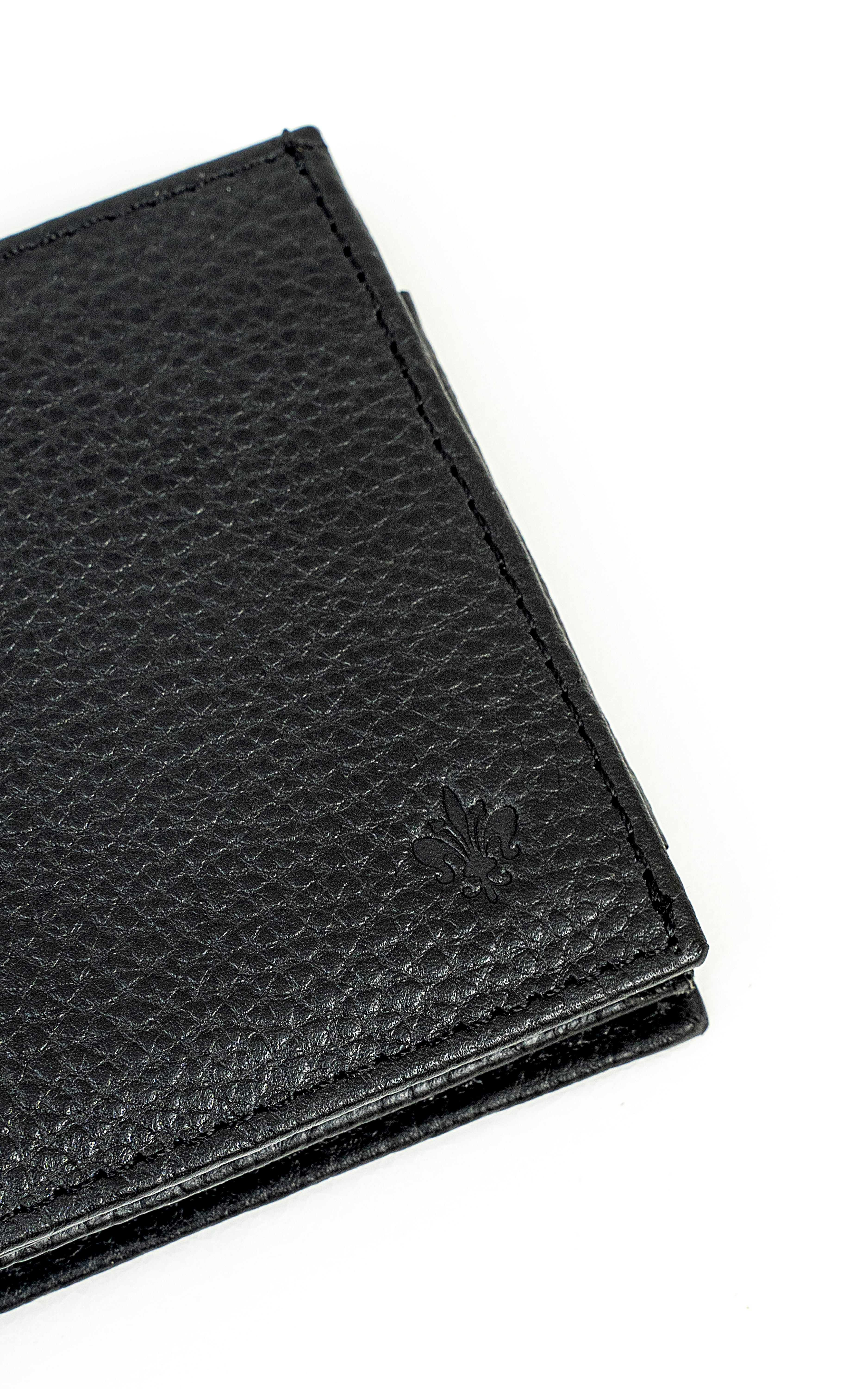 Black leather wallet close-up with textured grain and embossed emblem