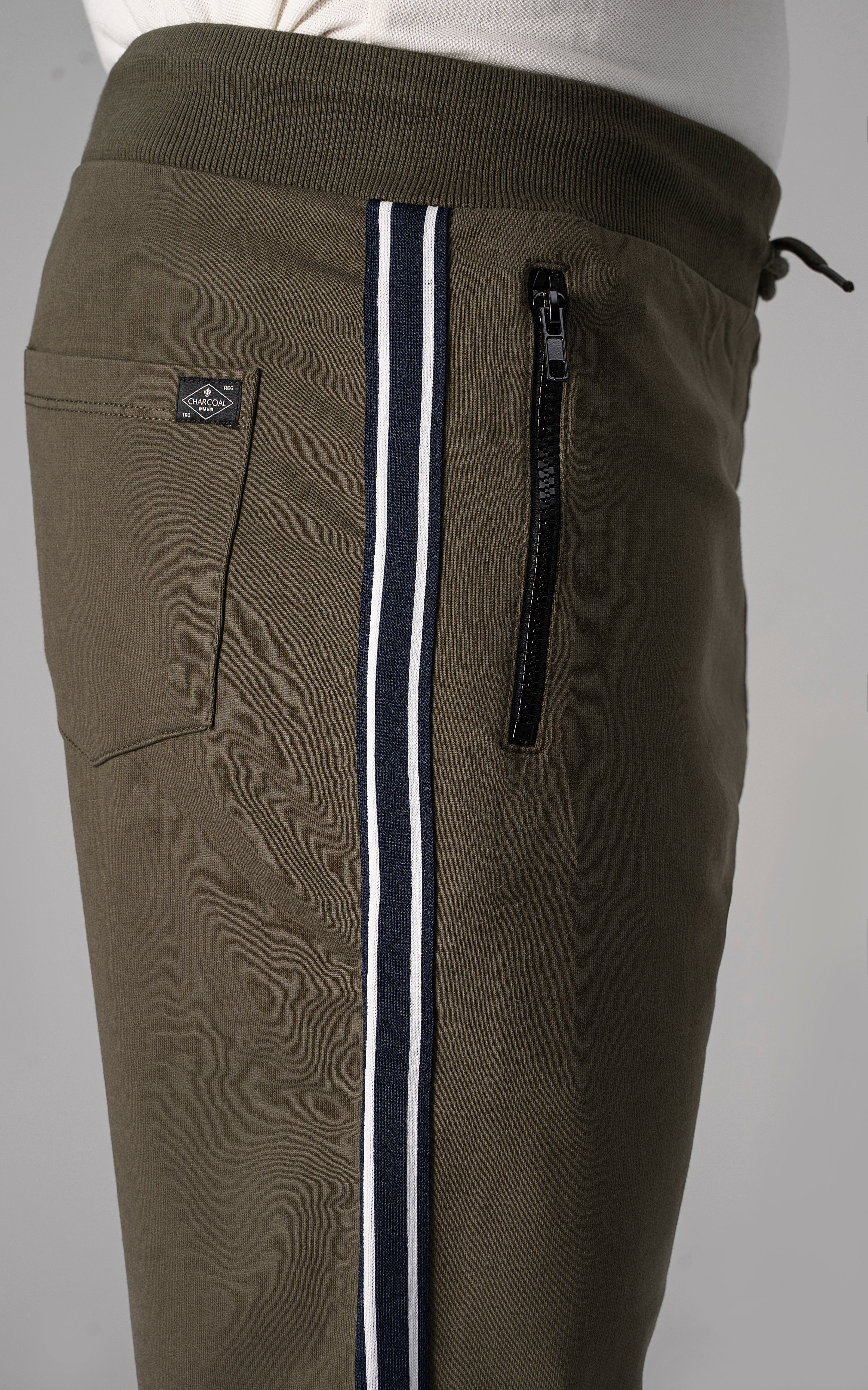 Olive casual shorts with side stripe tape and zip pocket at leg.