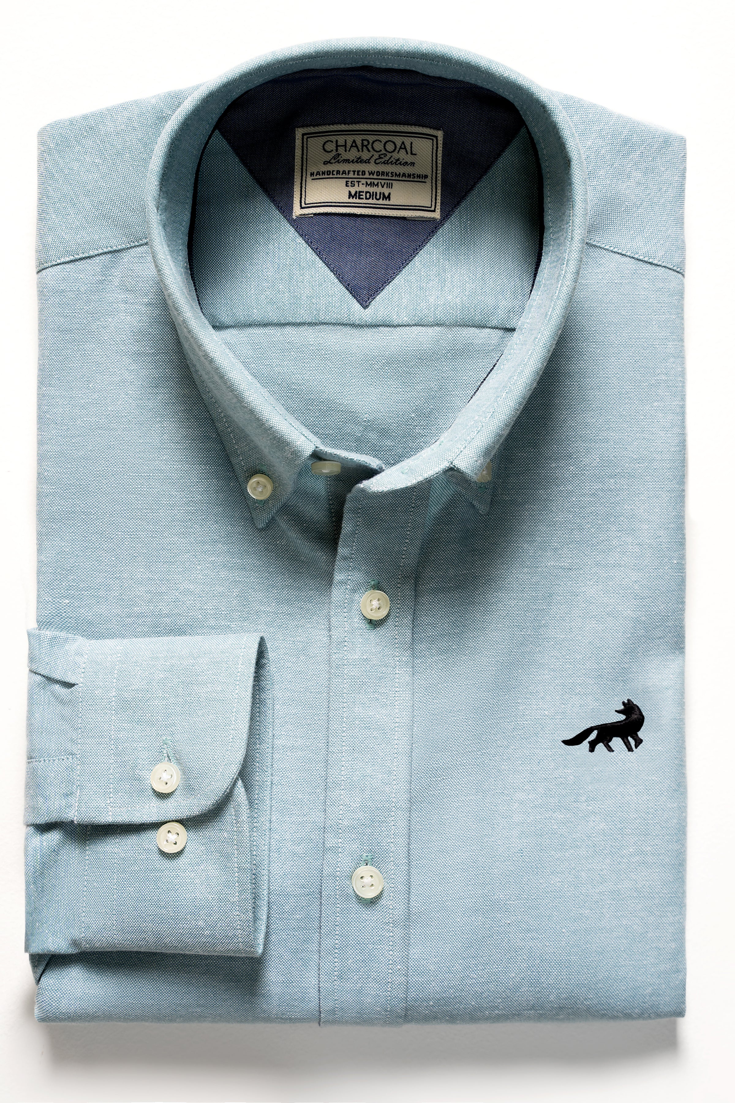 Limited edition light blue button-up shirt with chest pocket and logo
