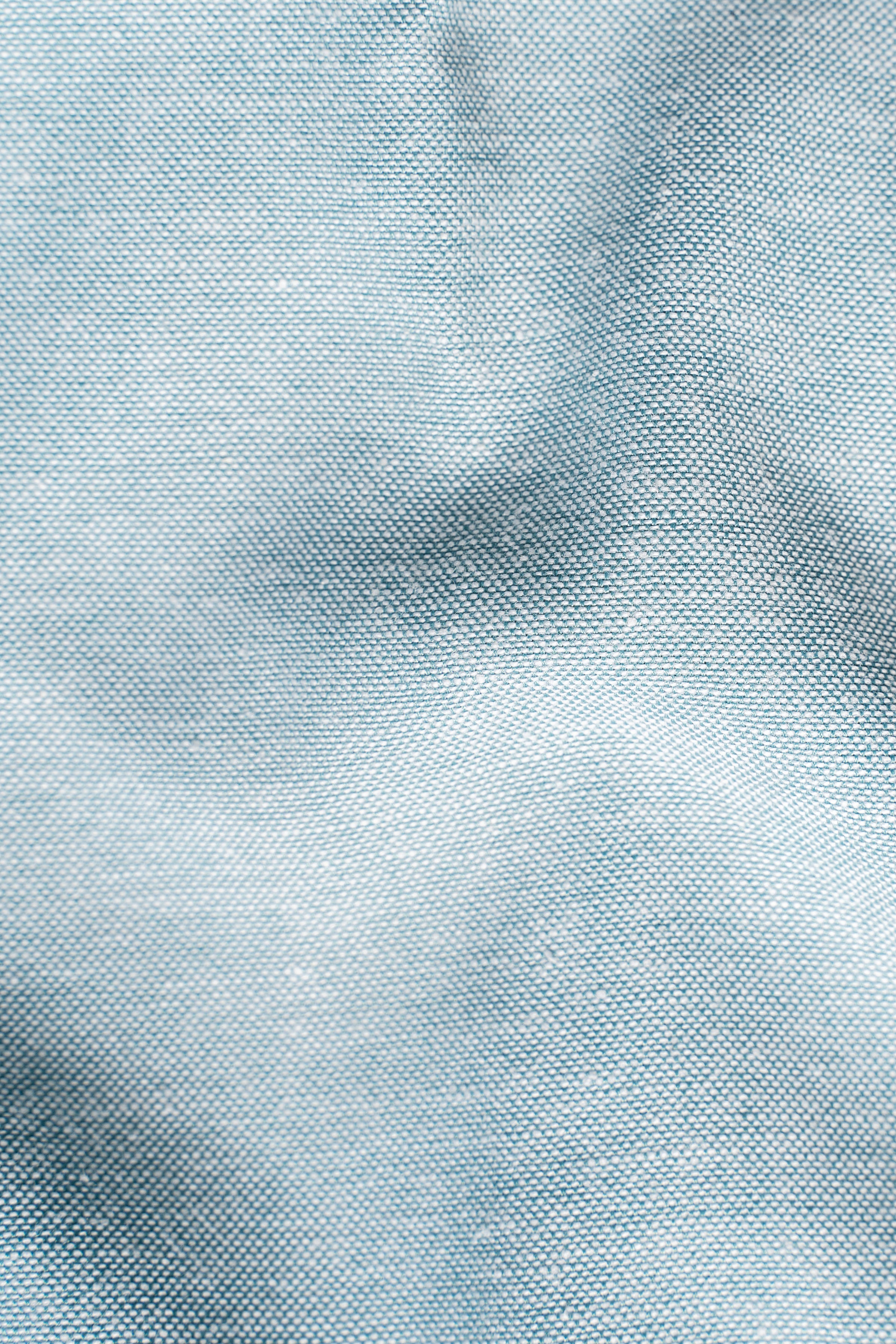 Limited edition light blue shirt fabric close-up