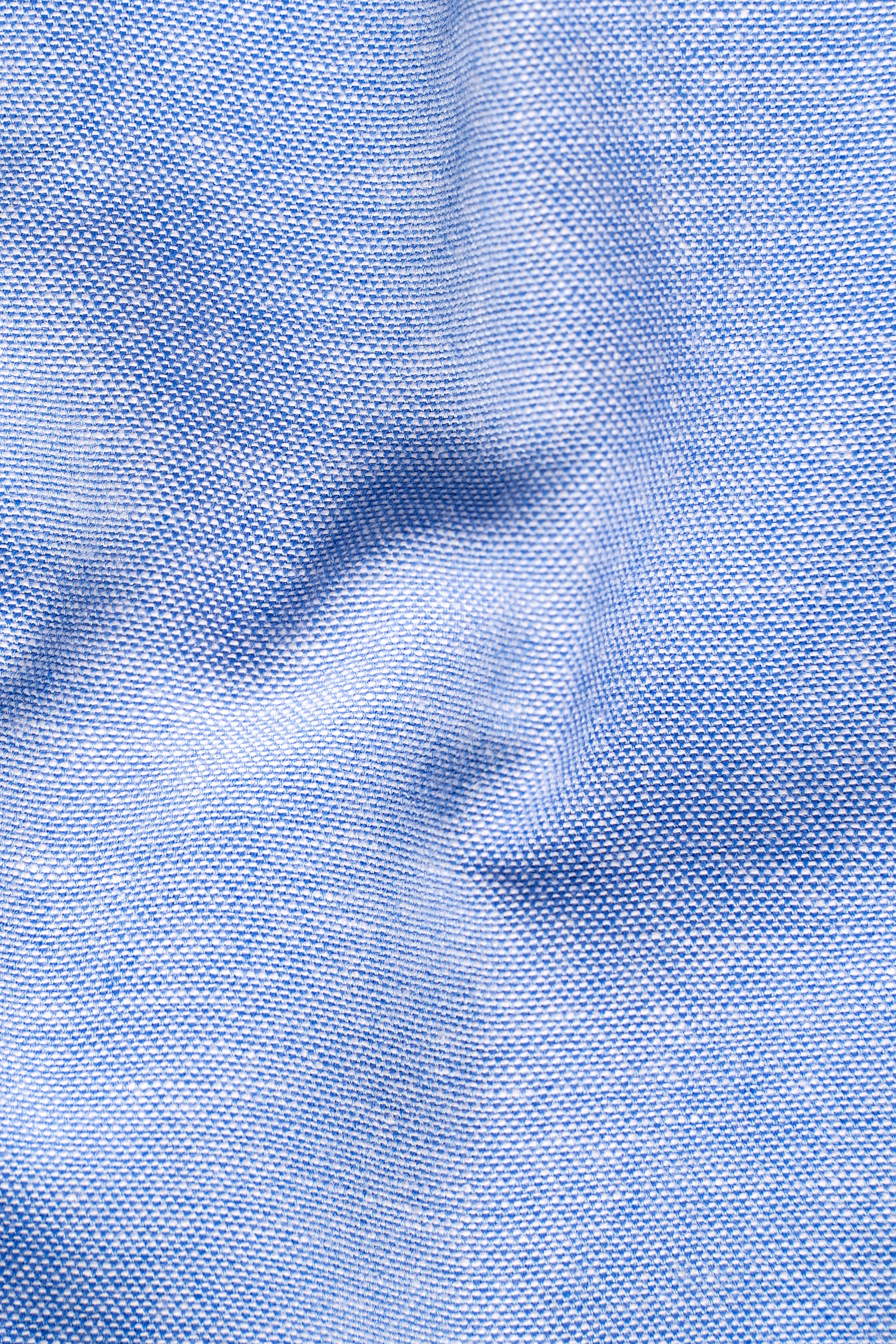 Light blue textured fabric with subtle woven pattern