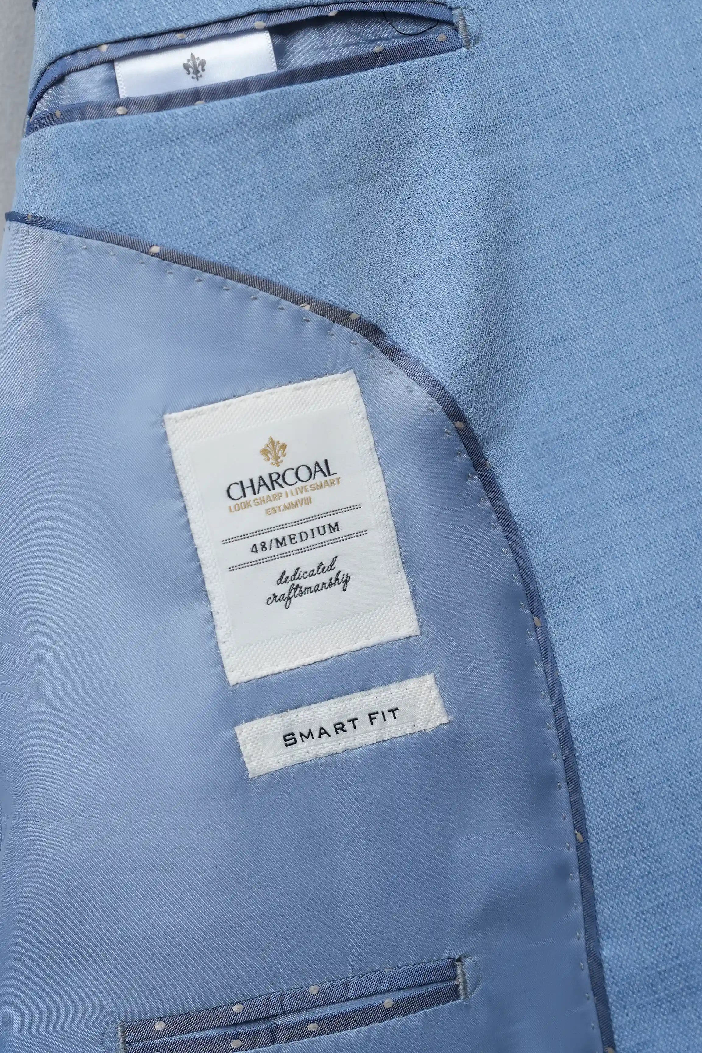 Light blue coat interior with Charcoal lining label and Smart Fit tag