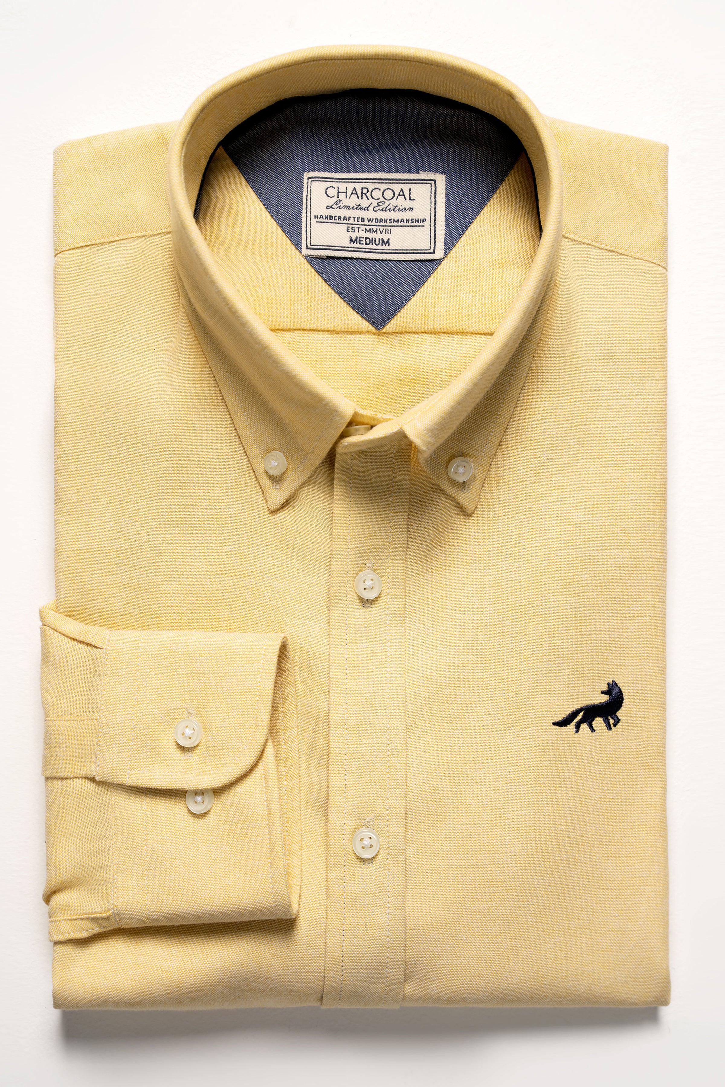 Lime yellow button-up shirt with chest pocket and black logo