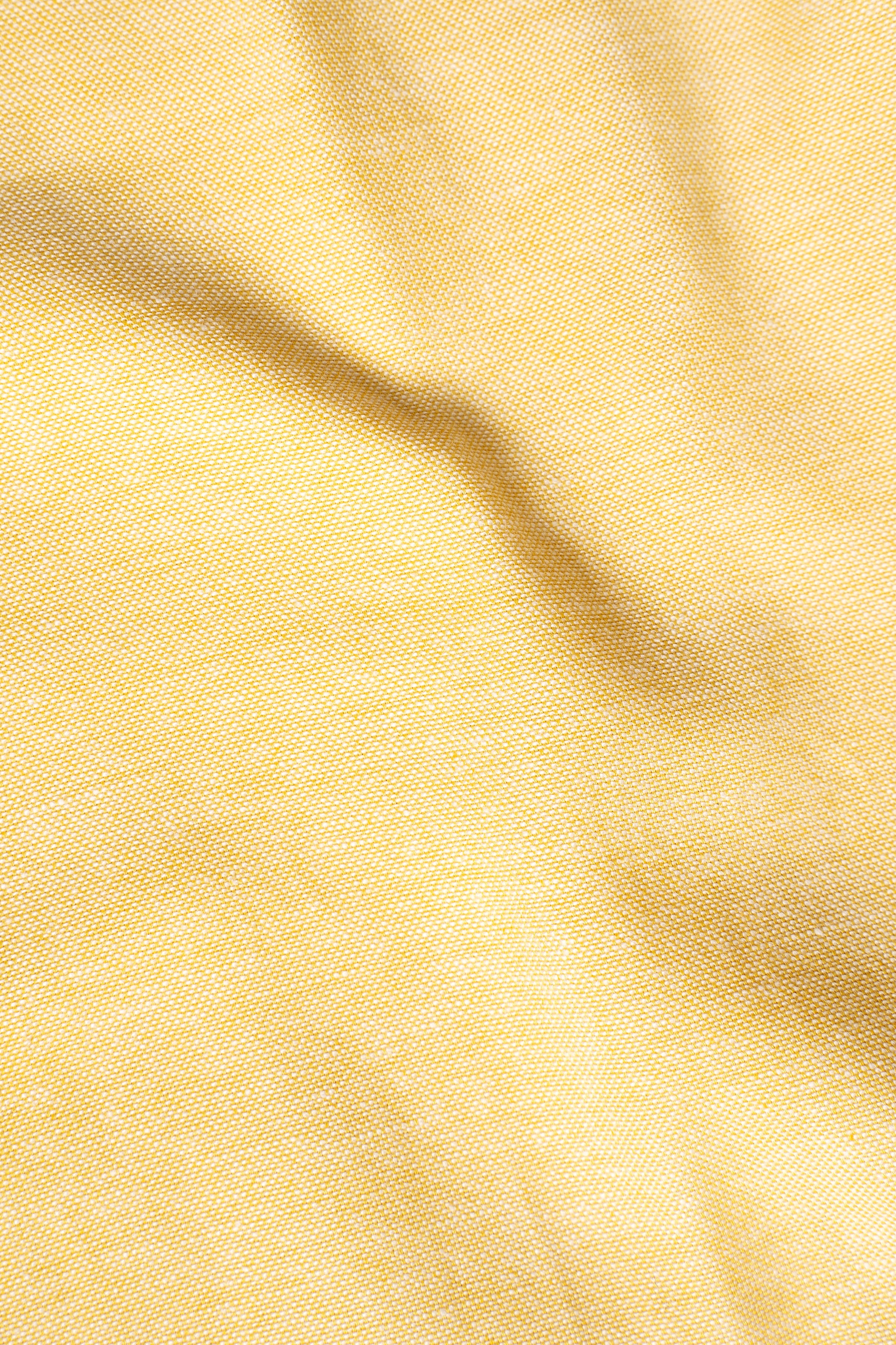 Lime yellow textured fabric close-up