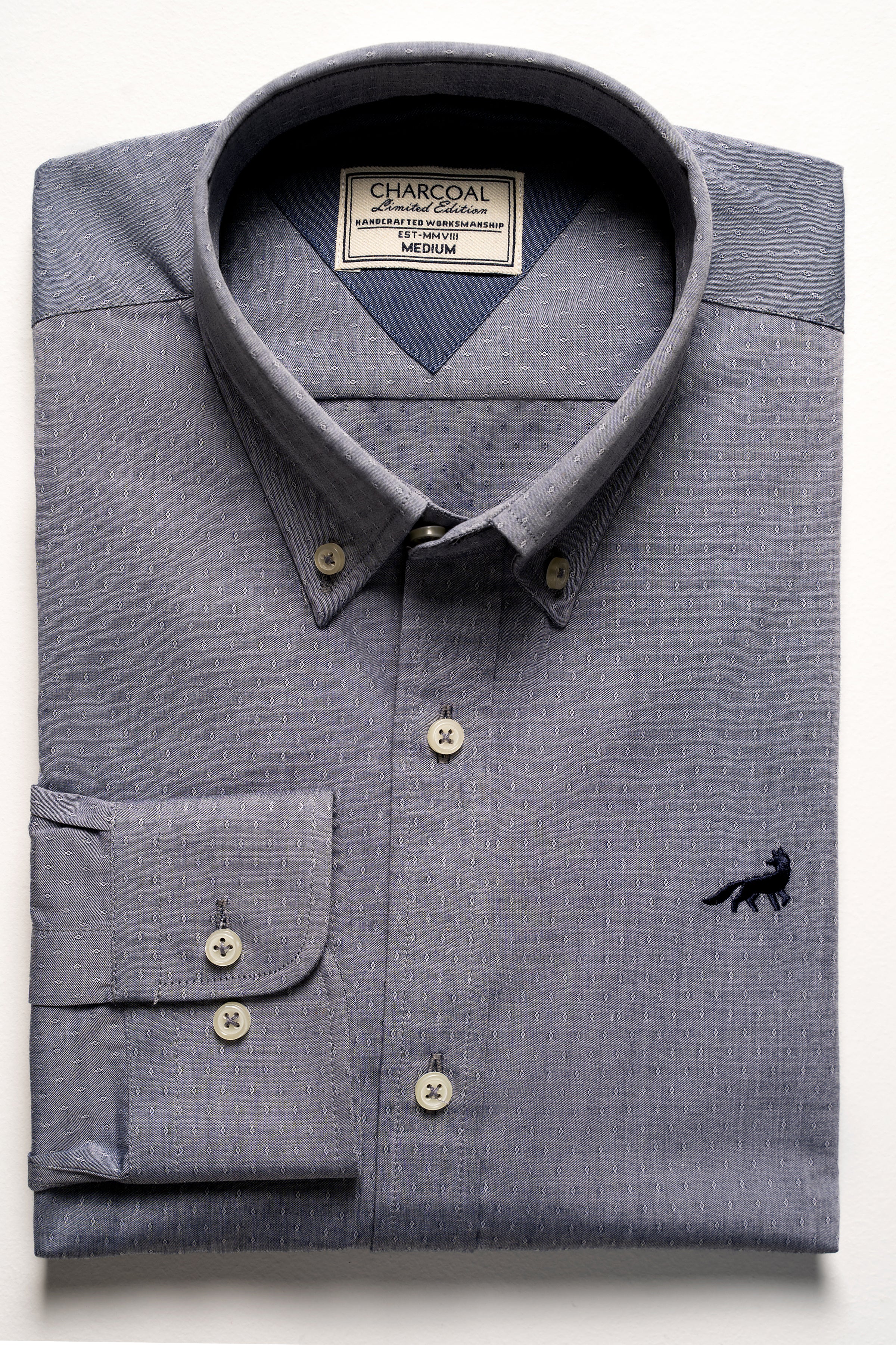 Grey button-up shirt with chest pocket, button placket, and small logo