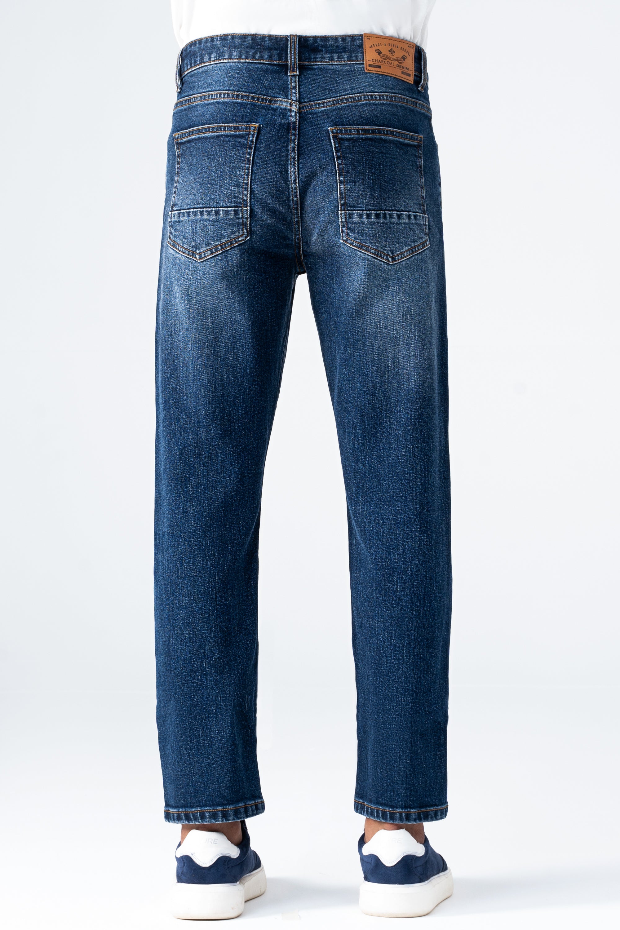 Straight-leg dark blue denim jeans back view with belt loops and stitched pockets
