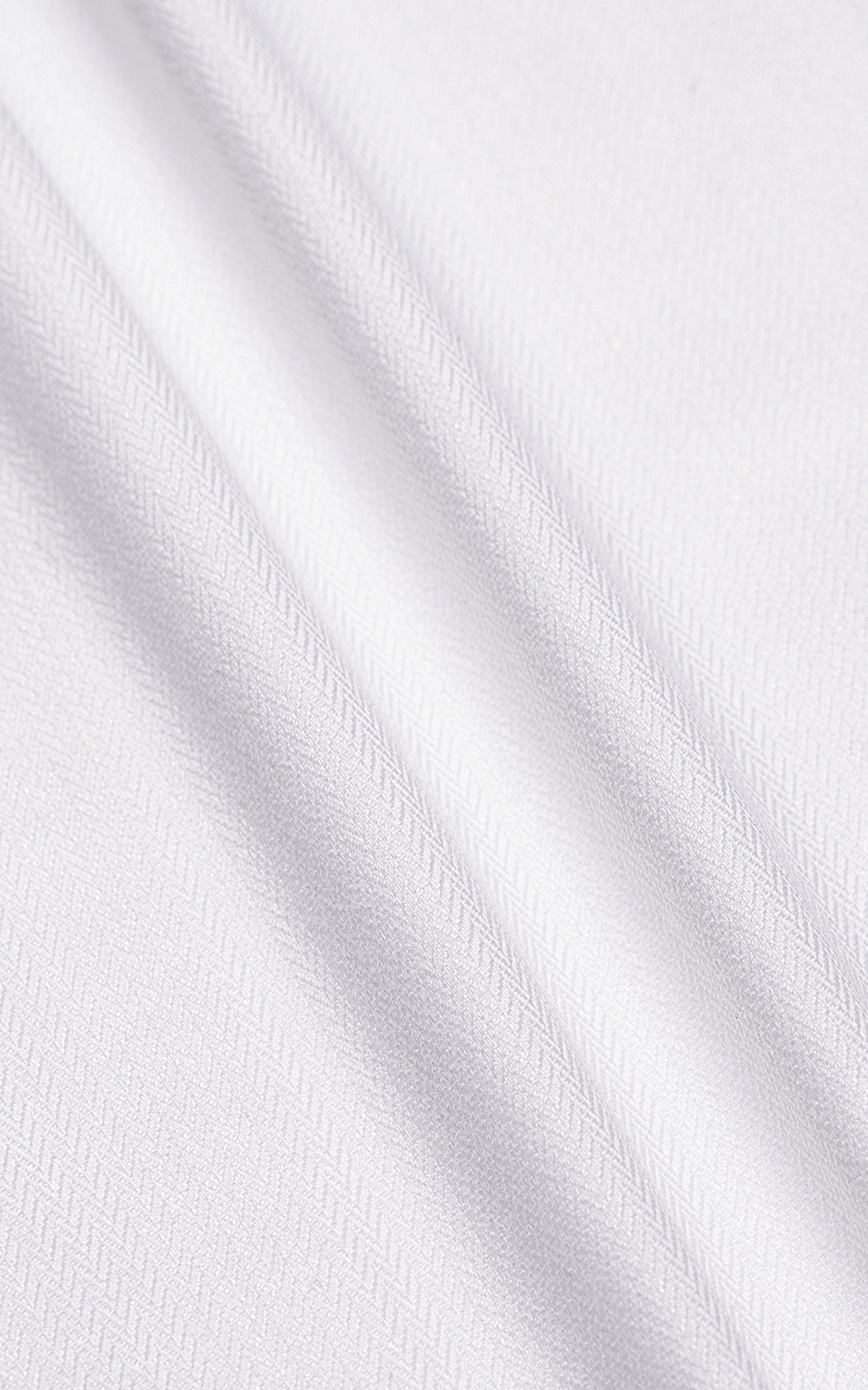 White shirt fabric texture with subtle diagonal weave