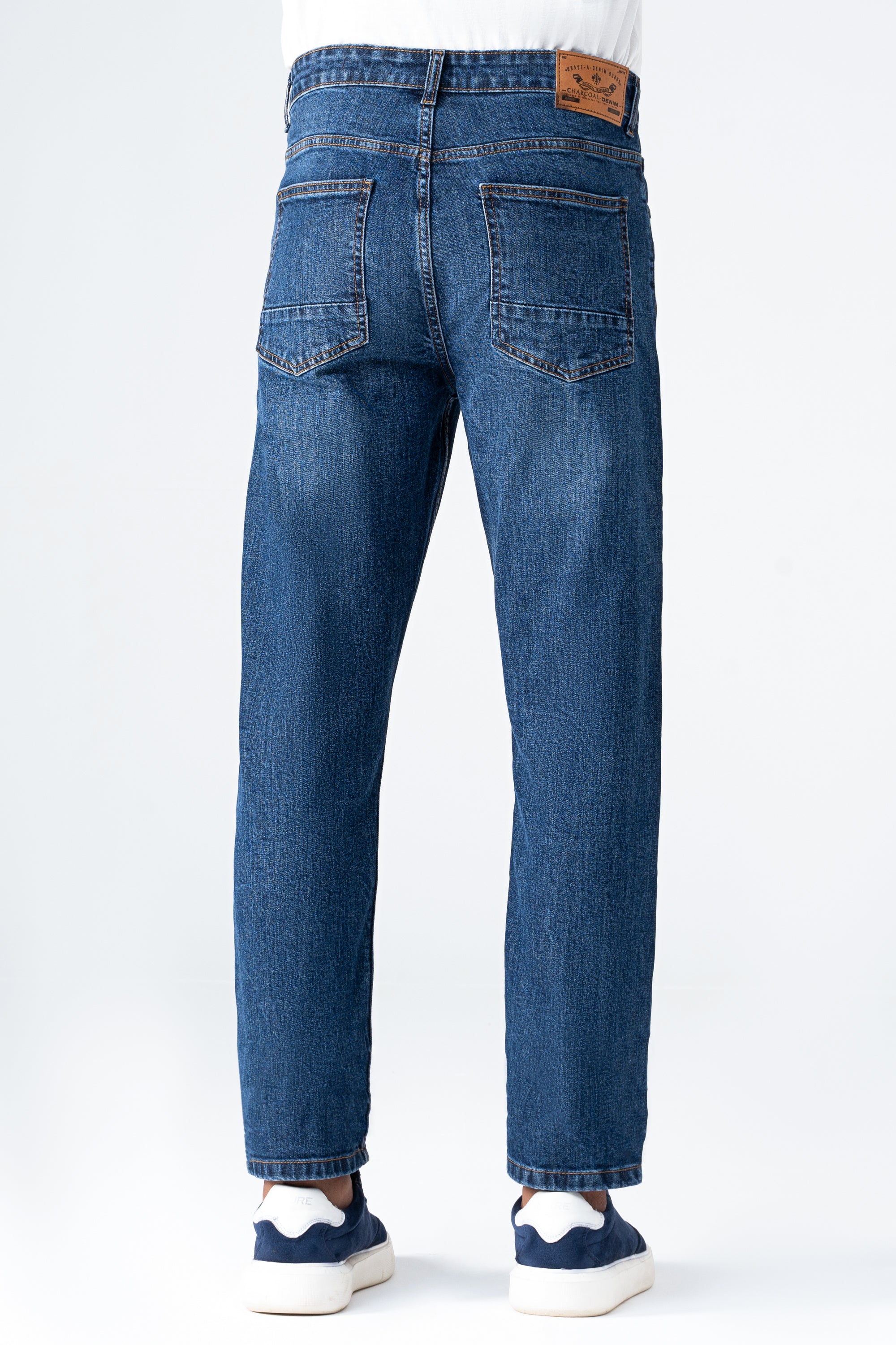 Mid blue straight-leg denim jeans with front button closure and stitched pockets.