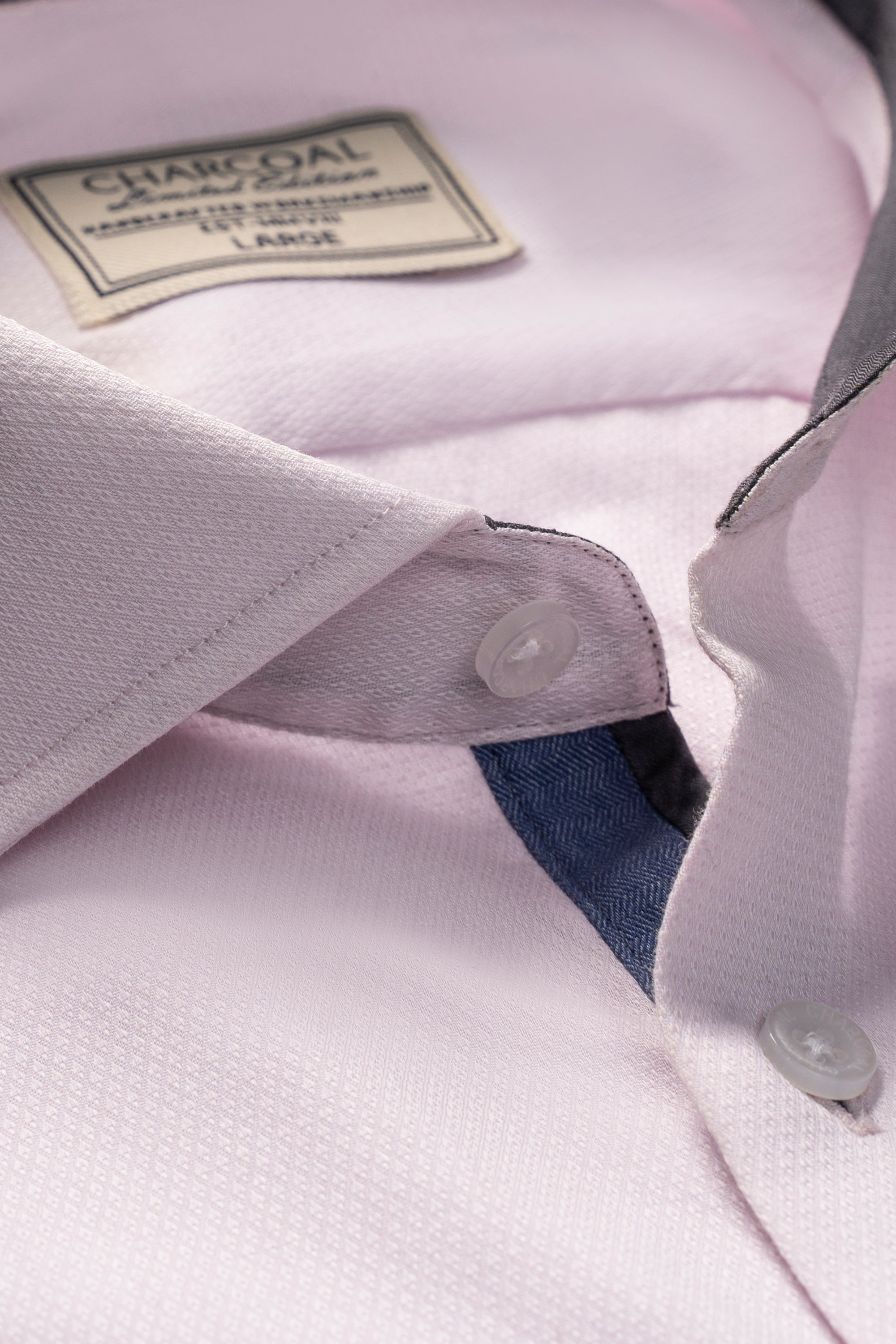 Light pink button-up shirt, collar label and button placket with contrast inner trim