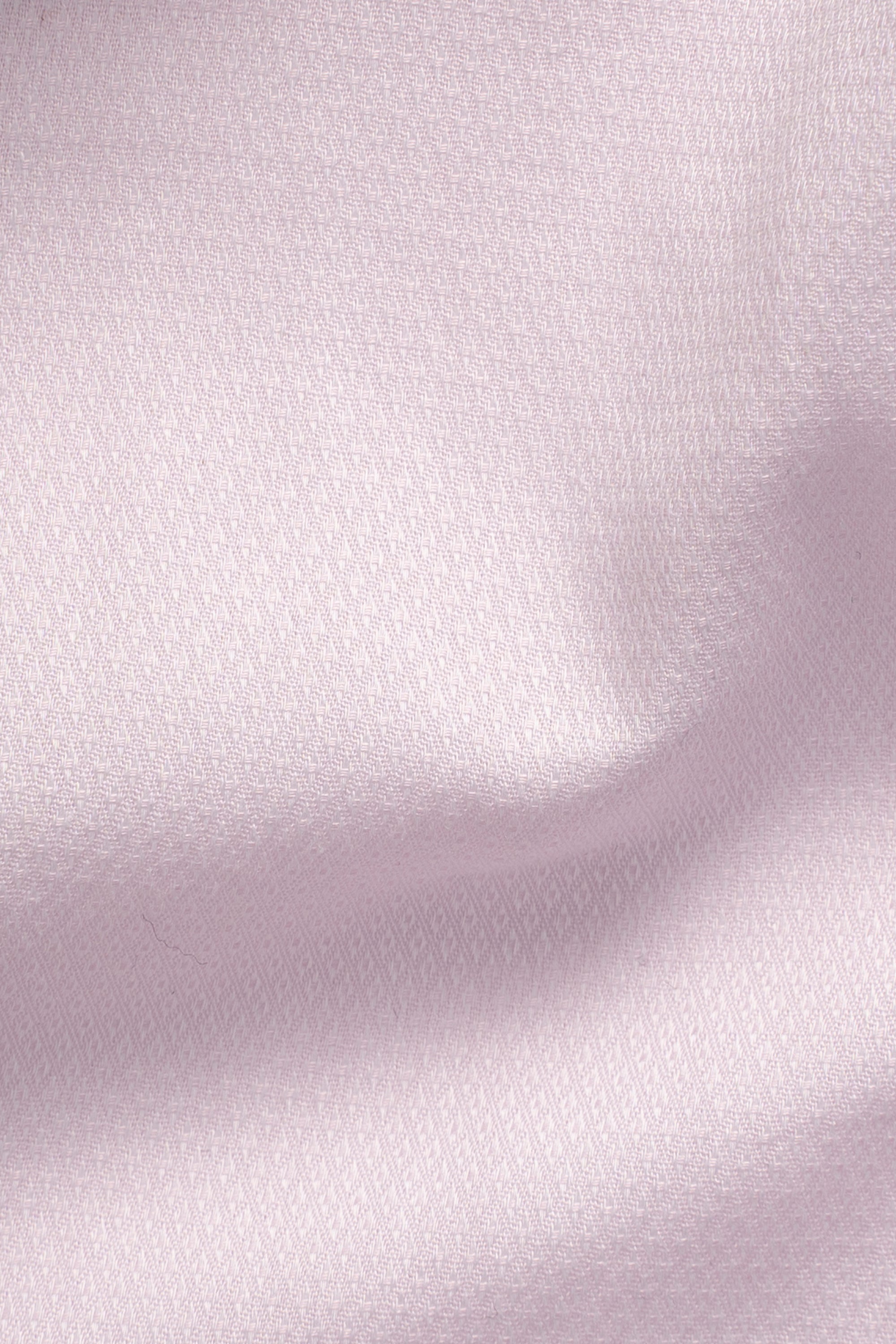 Light pink shirt fabric close-up with fine textured weave