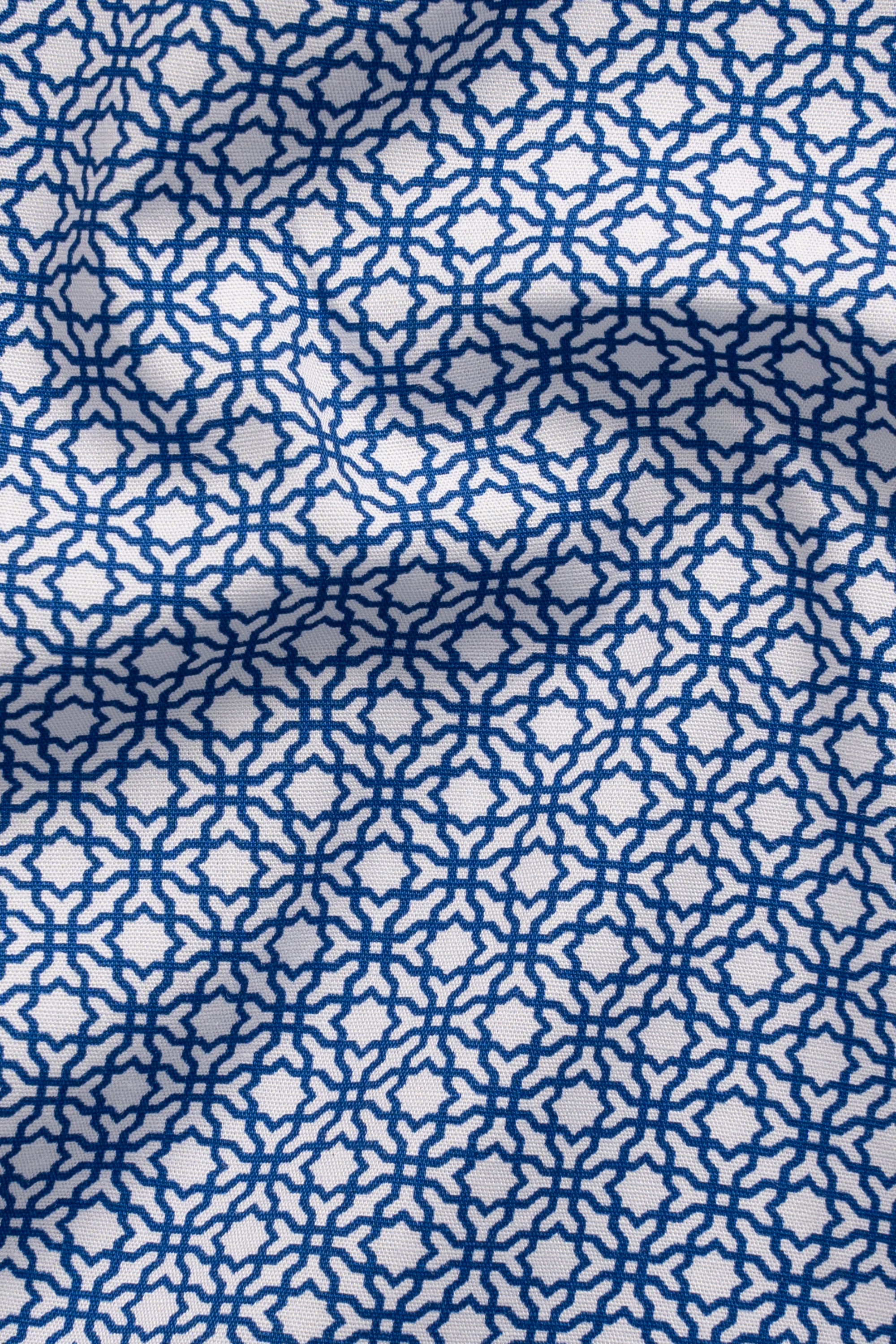 Navy fabric with repeating white geometric pattern for a half-sleeve shirt