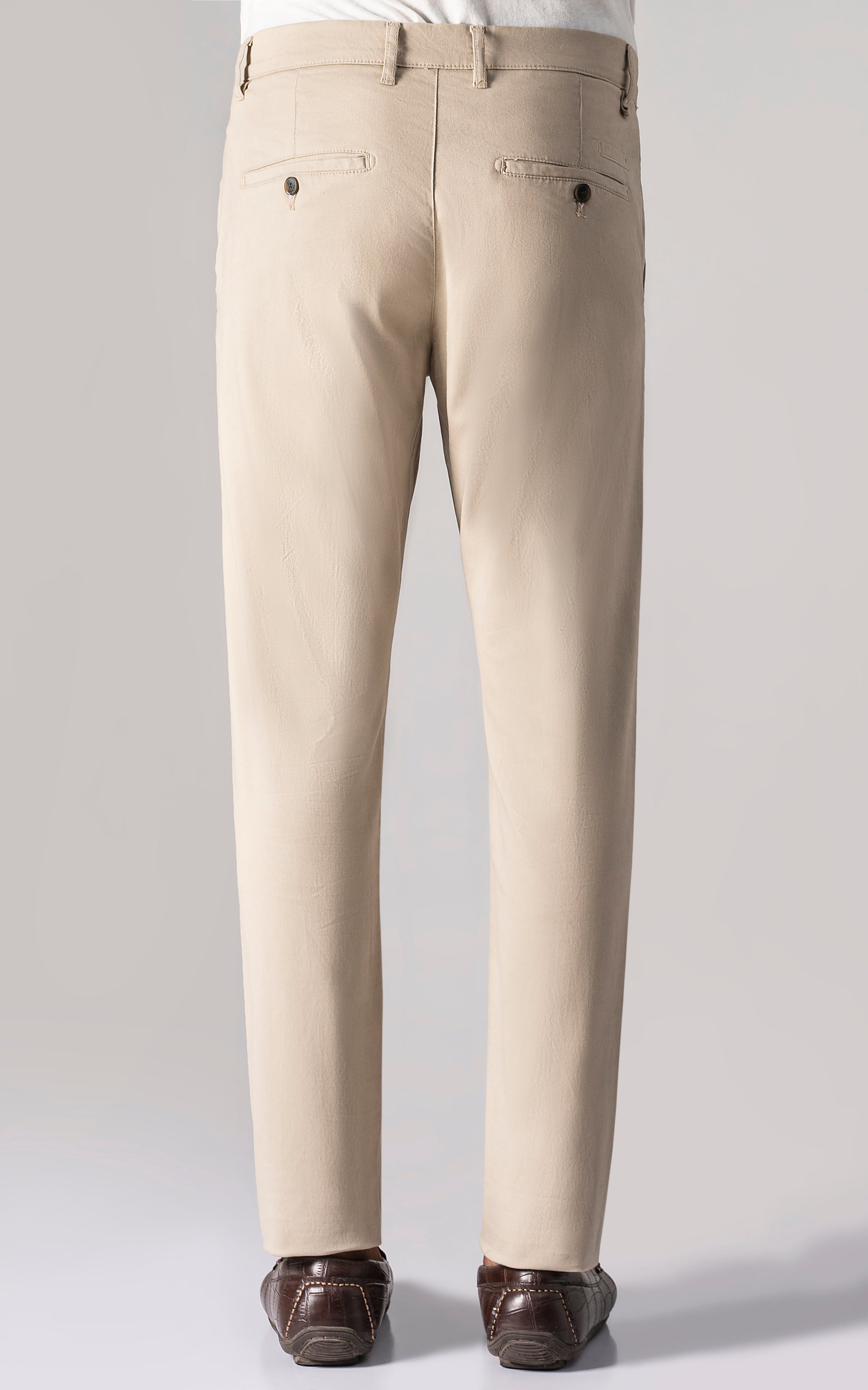 Light khaki trousers back view with two buttoned pockets and center seam