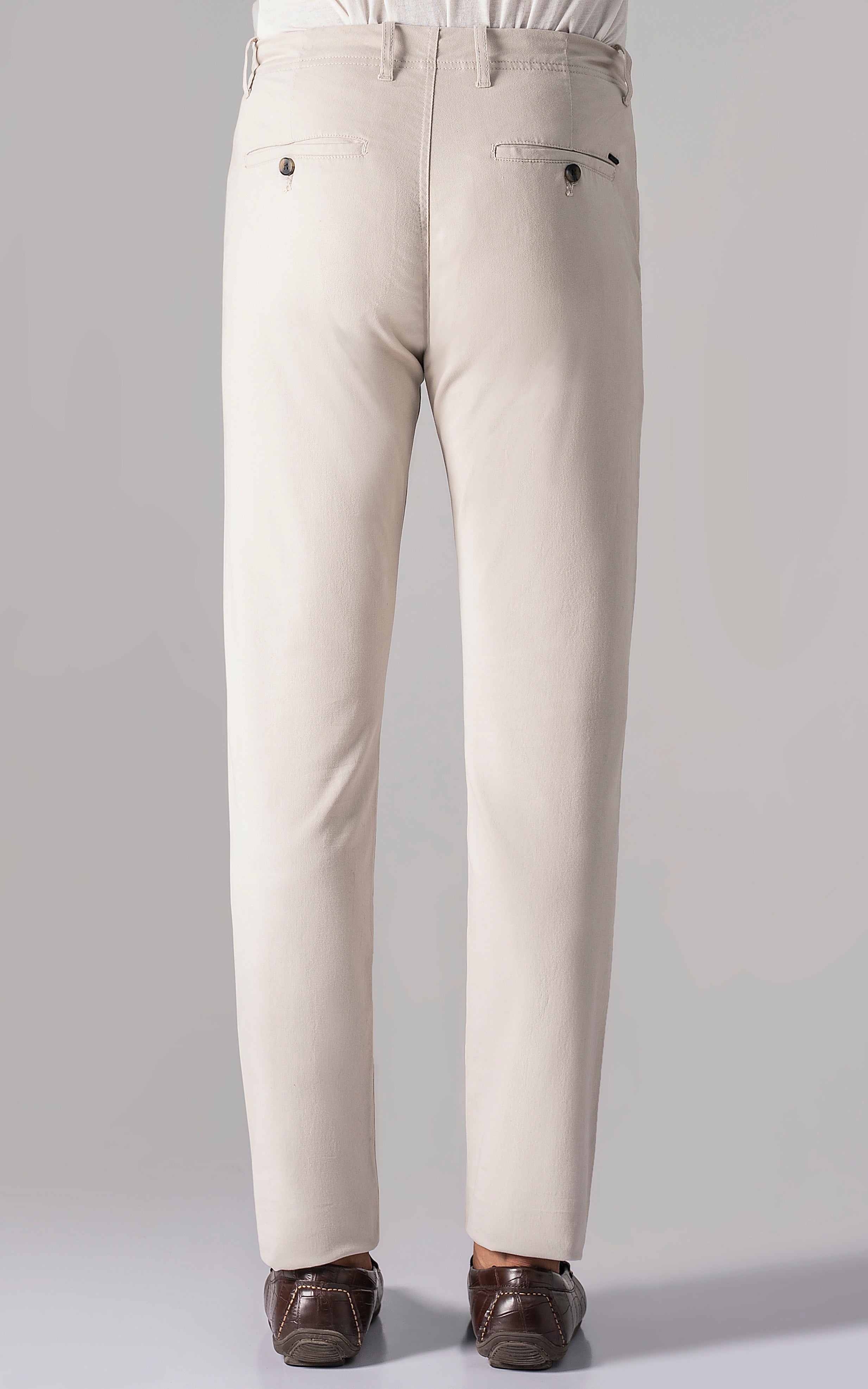 Ecru casual pants featuring two back button pockets and straight legs