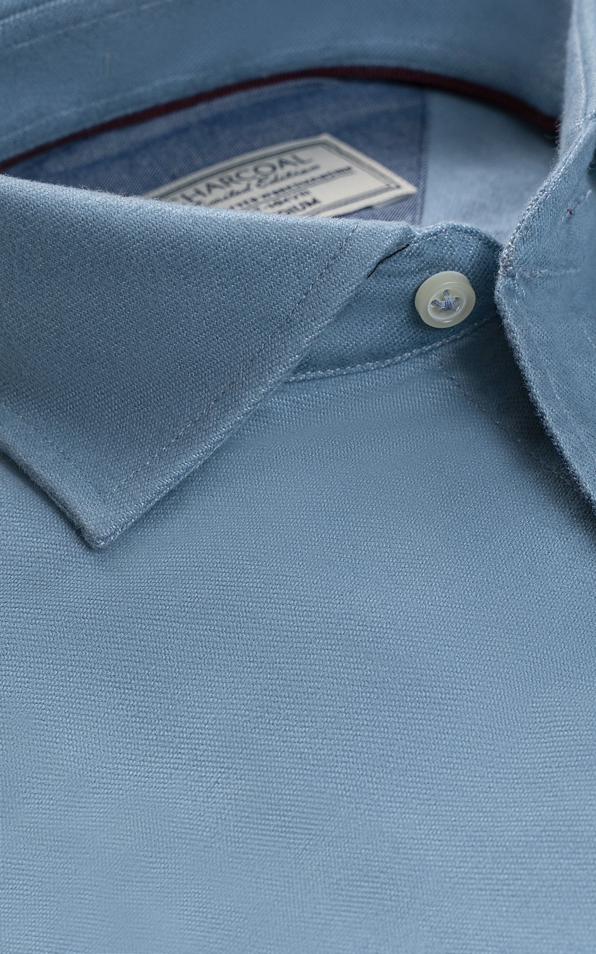 Sky blue shirt collar and button placket close-up