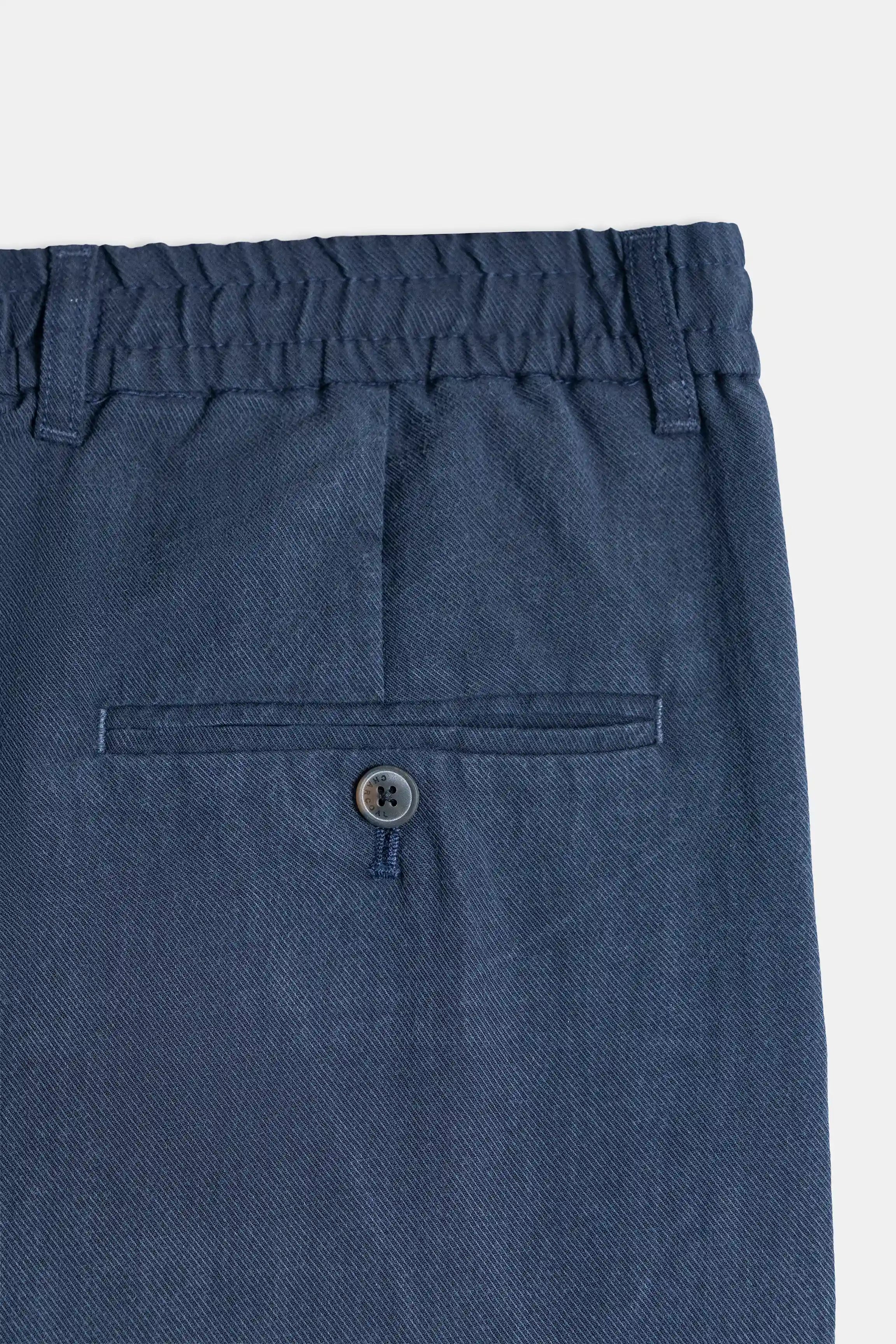 Navy front cross pocket with button closure on elastic-waist pants