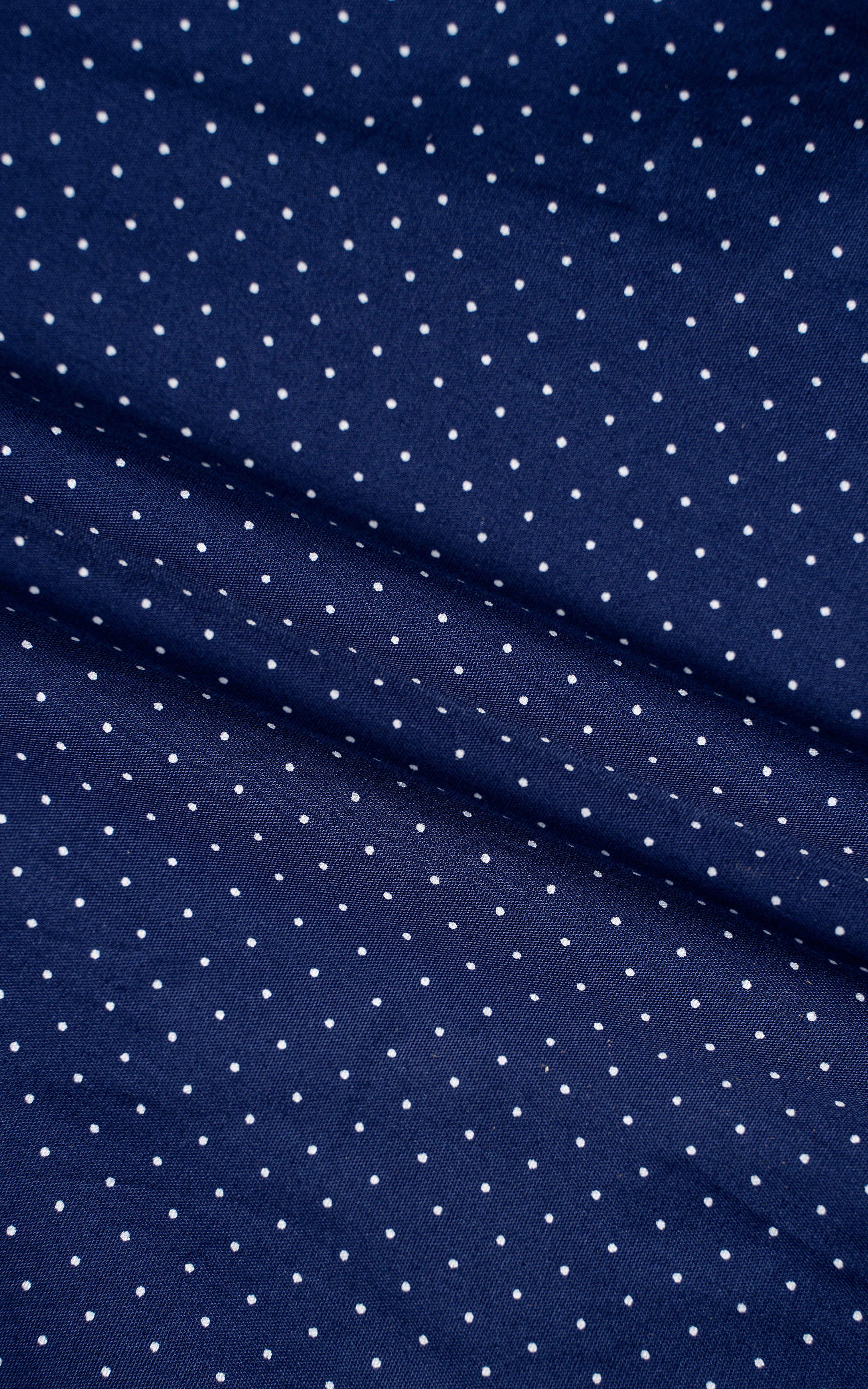 Navy blue shirt fabric with small white dot pattern