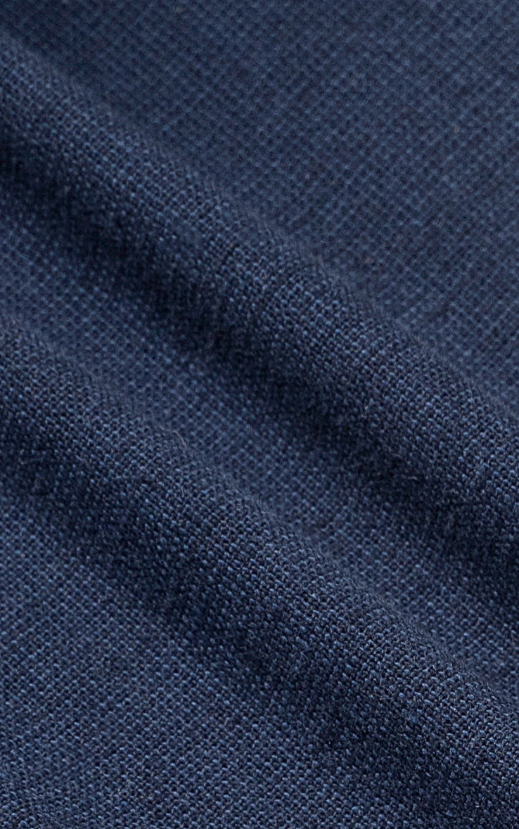 Navy linen fabric closeup with visible woven texture