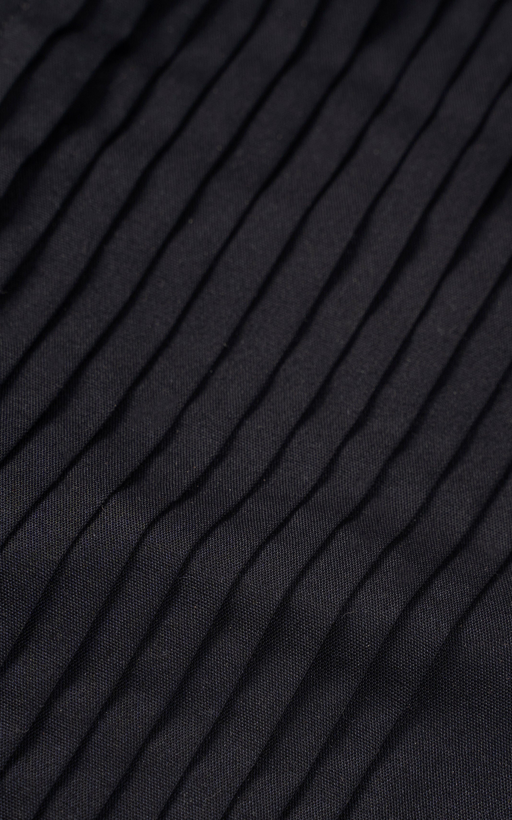 Dark fabric with subtle vertical pinstripes