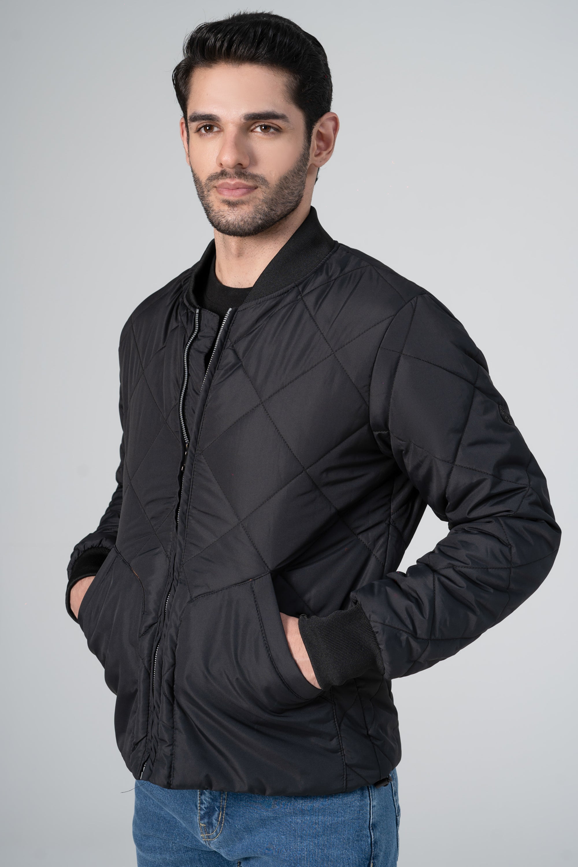 Quilted black bomber jacket with zip front, diamond quilting and elastic cuffs