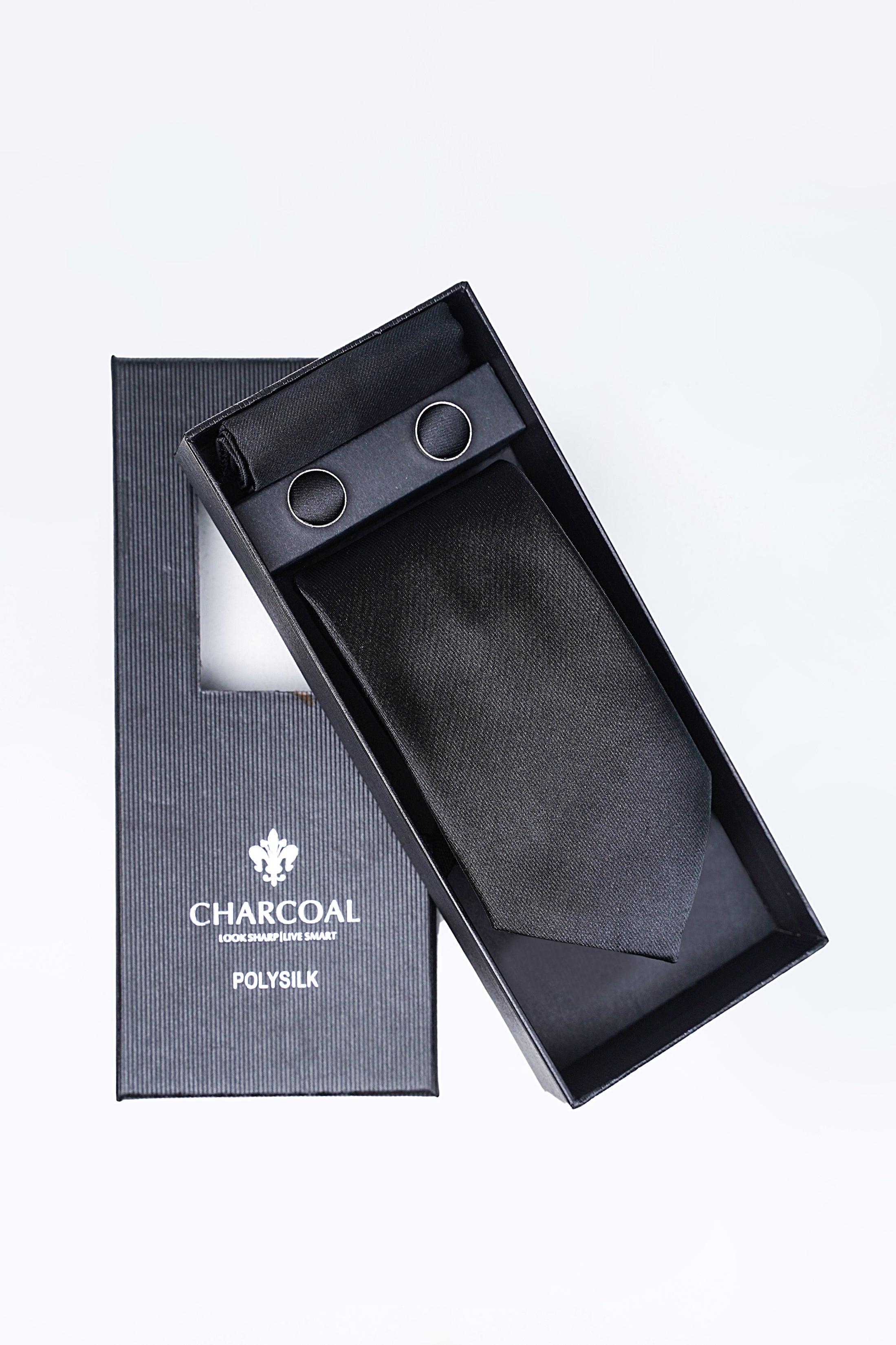 Box tie set in charcoal: necktie, pocket square, and cufflinks in gift box.