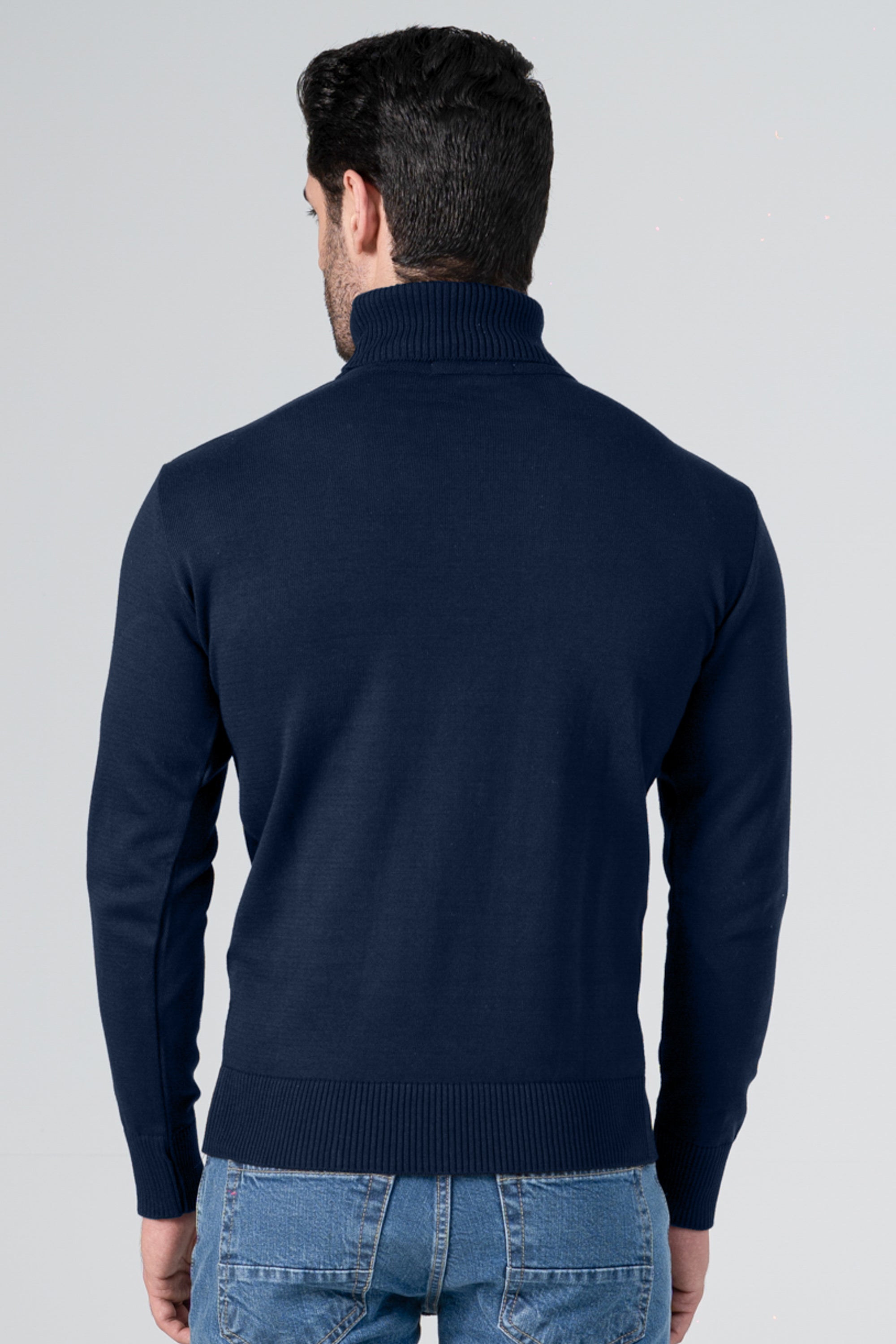 Navy knit turtleneck sweater with ribbed hem and long sleeves, back view
