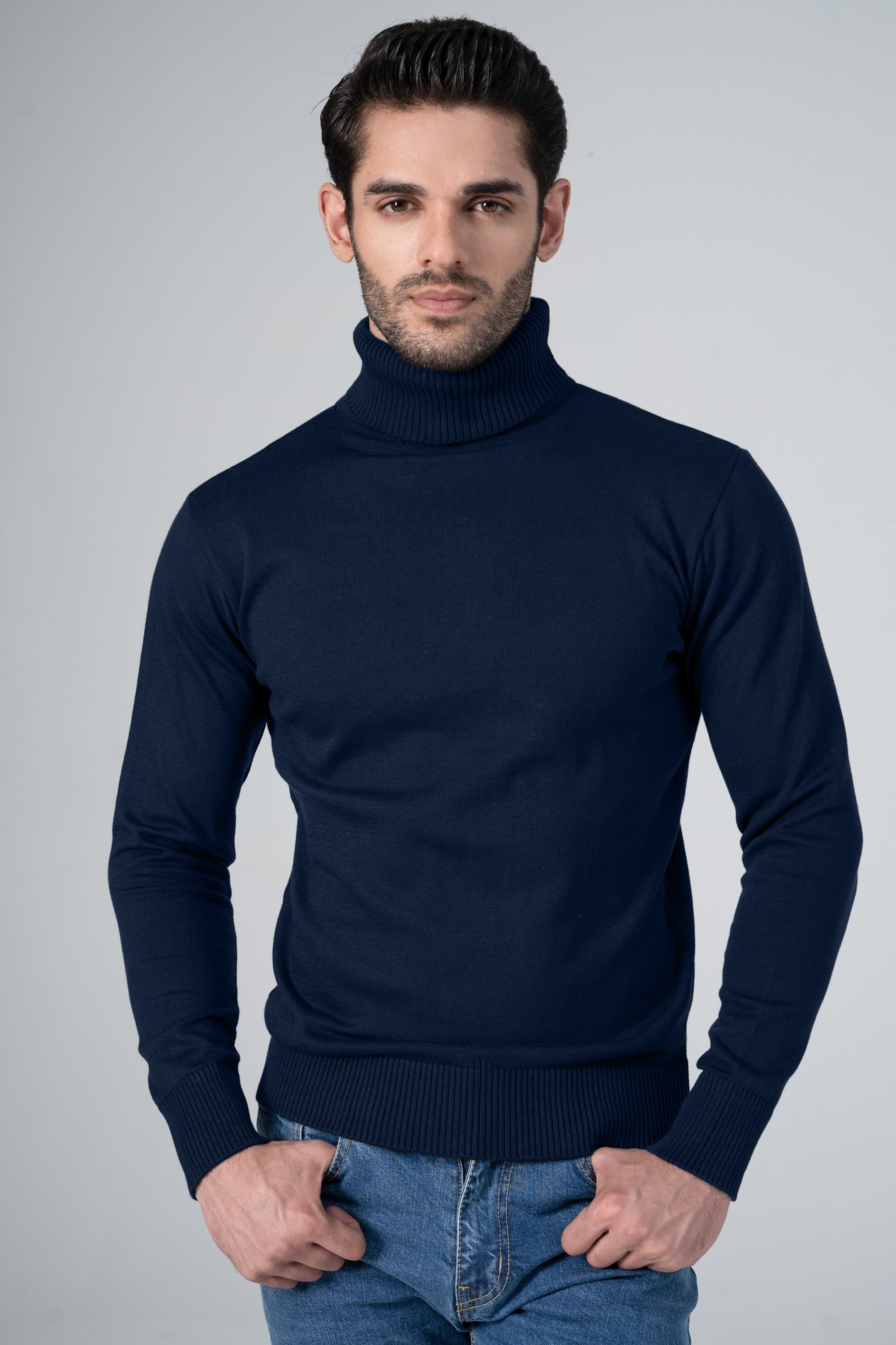Navy turtleneck sweater with high neckline and ribbed cuffs