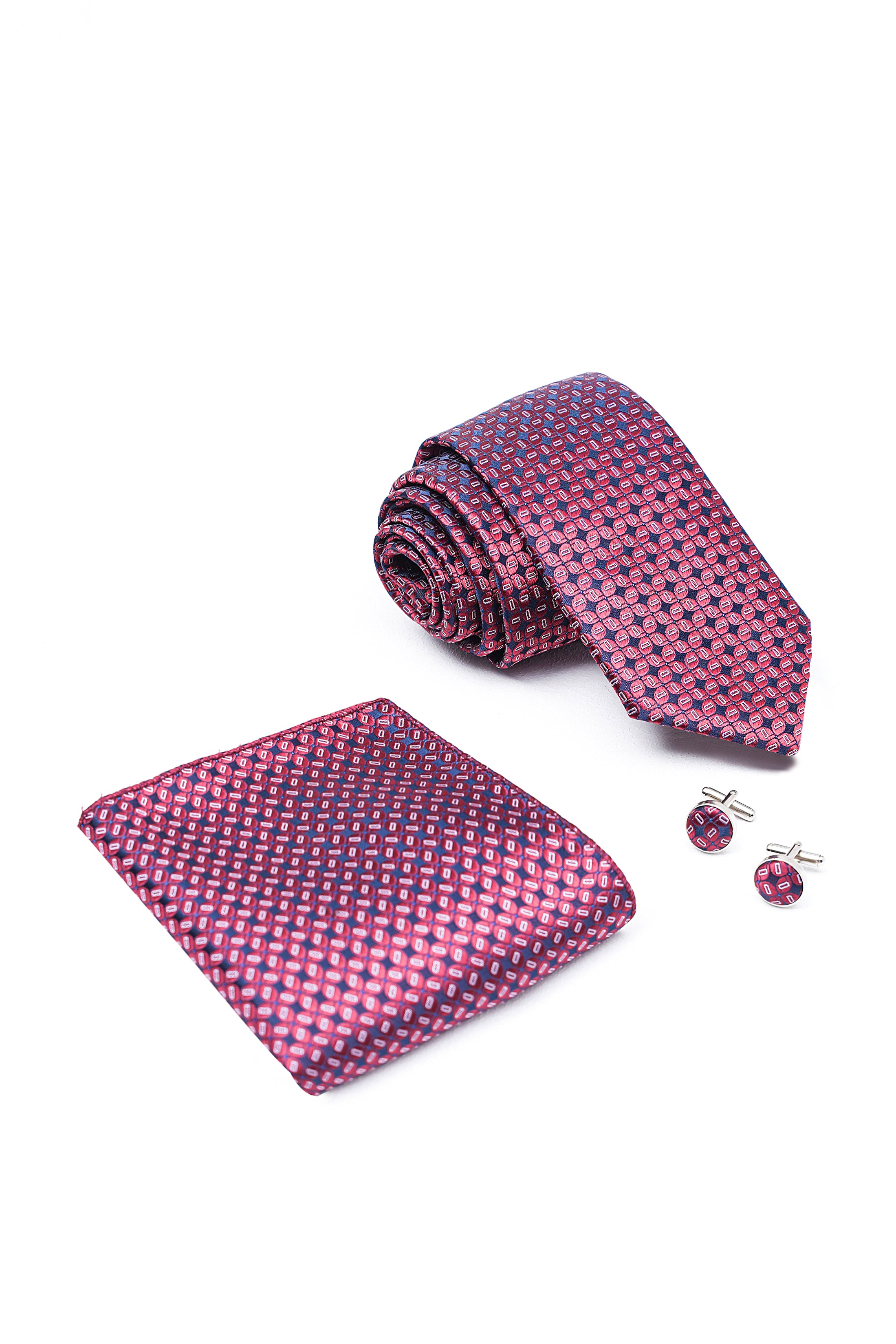 Pink patterned tie set with folded tie, pocket square, and round cufflinks
