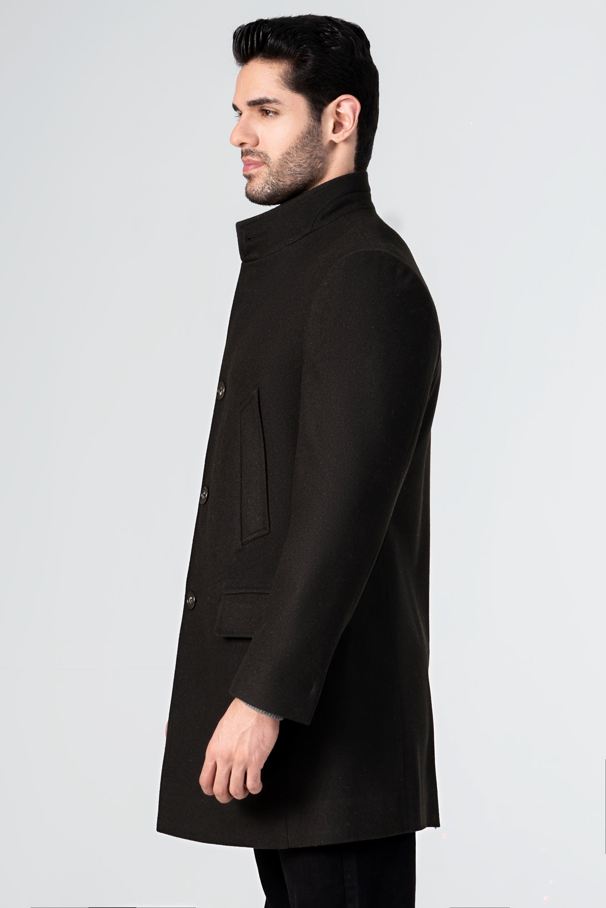 Dark olive wool long coat, side view with stand collar and buttoned placket