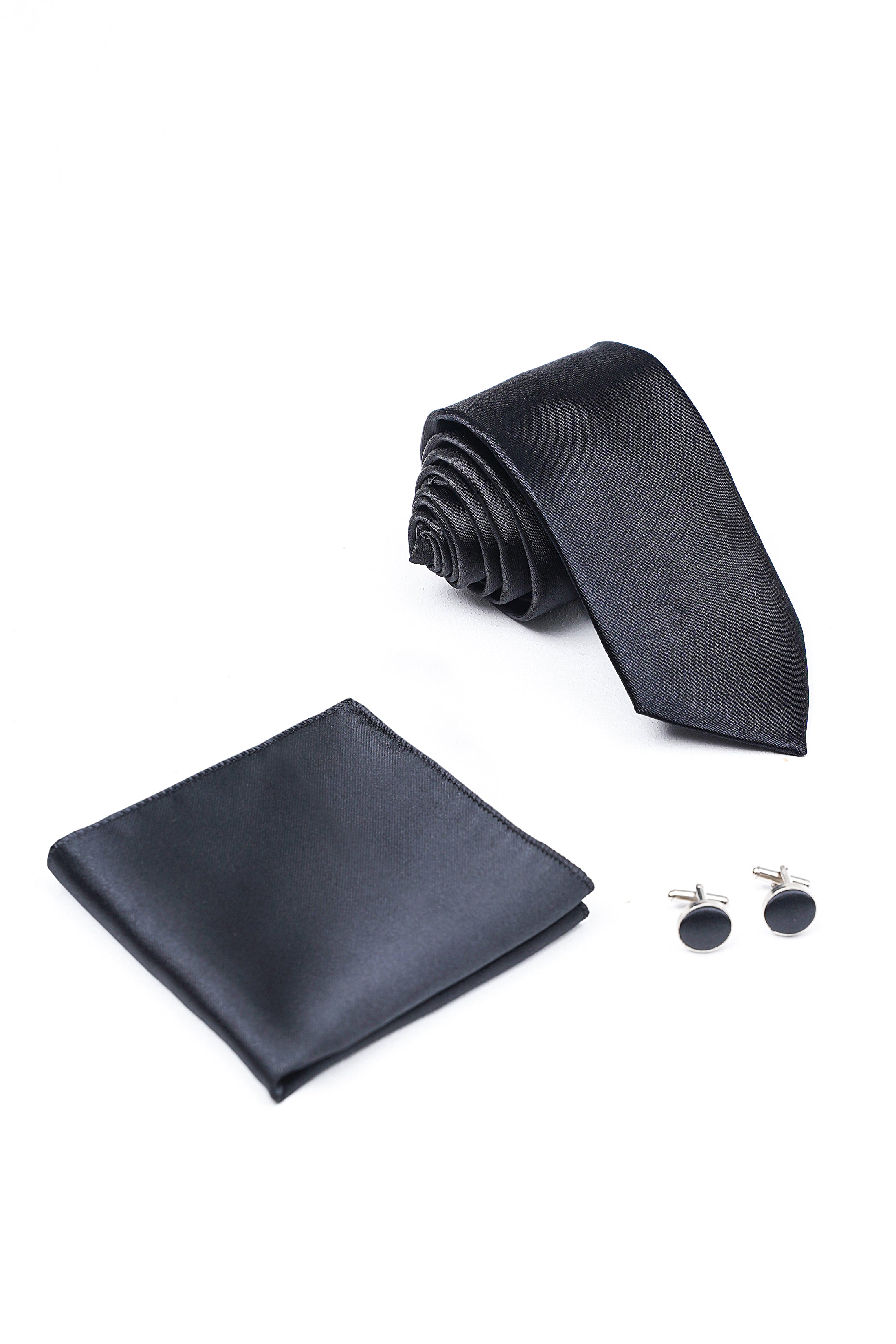 Charcoal necktie, folded pocket square, and round cufflinks—tie set.