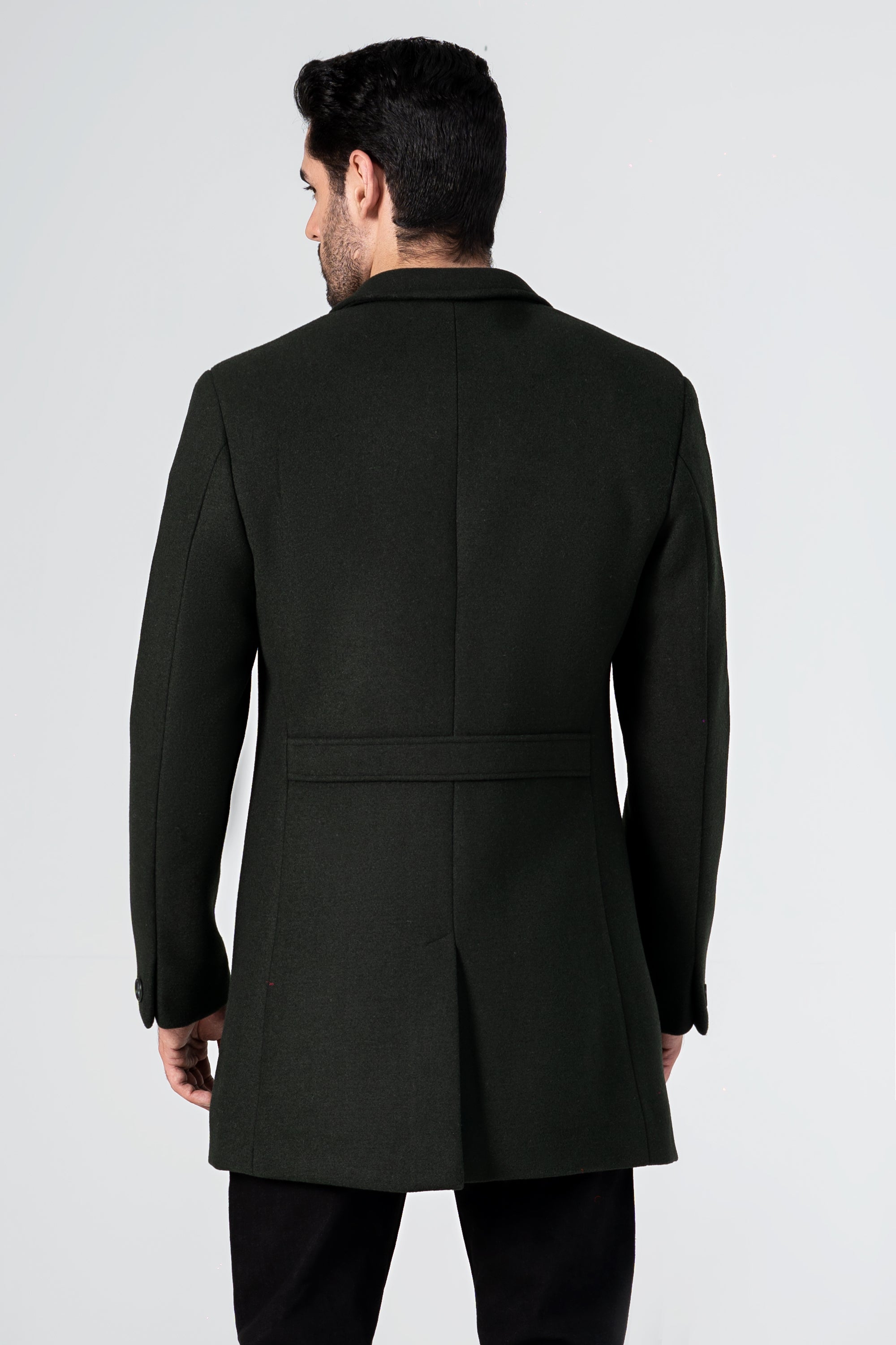 Dark green wool long coat back view with center seam and rear vent