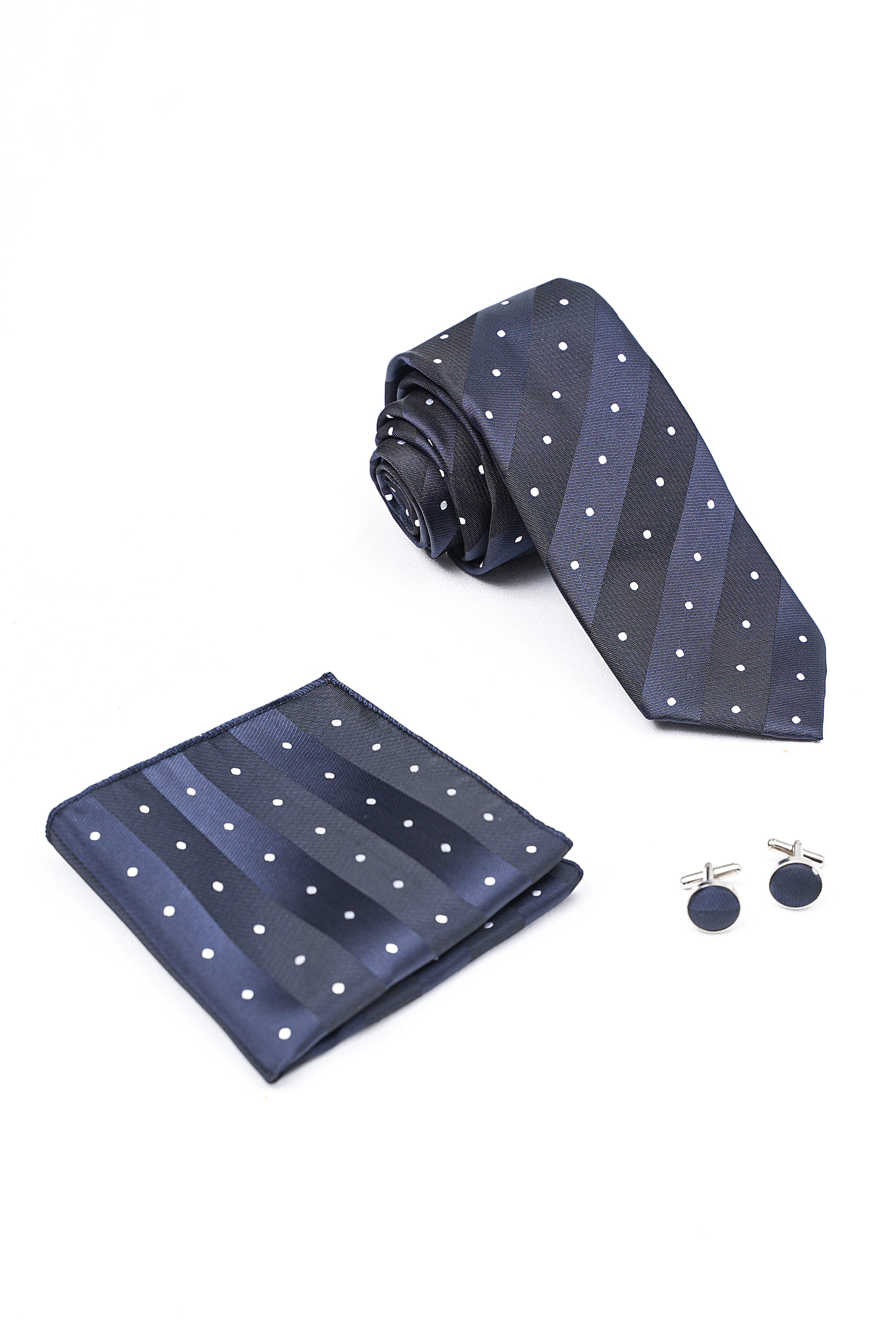 Navy dotted tie with folded pocket square and round cufflinks