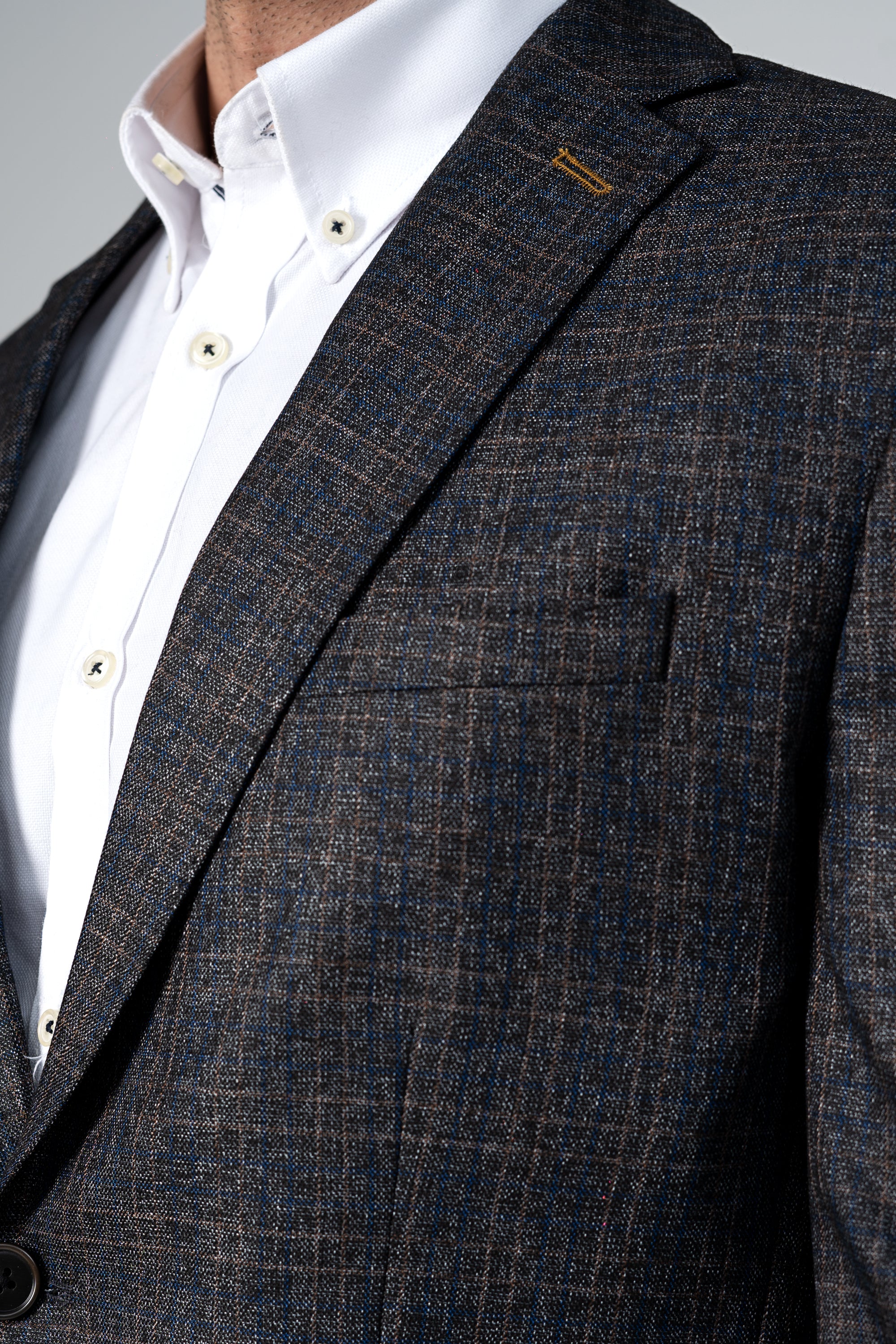 Dark brown casual coat with notch lapel, front buttons, and chest pocket detail
