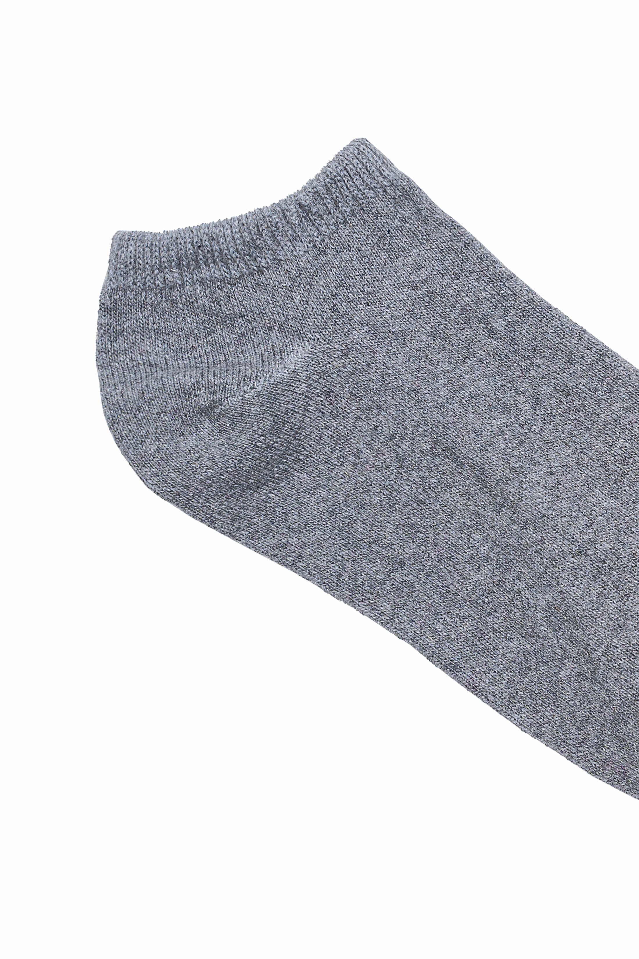 Gray ankle sock close-up with ribbed knit cuff and textured fabric