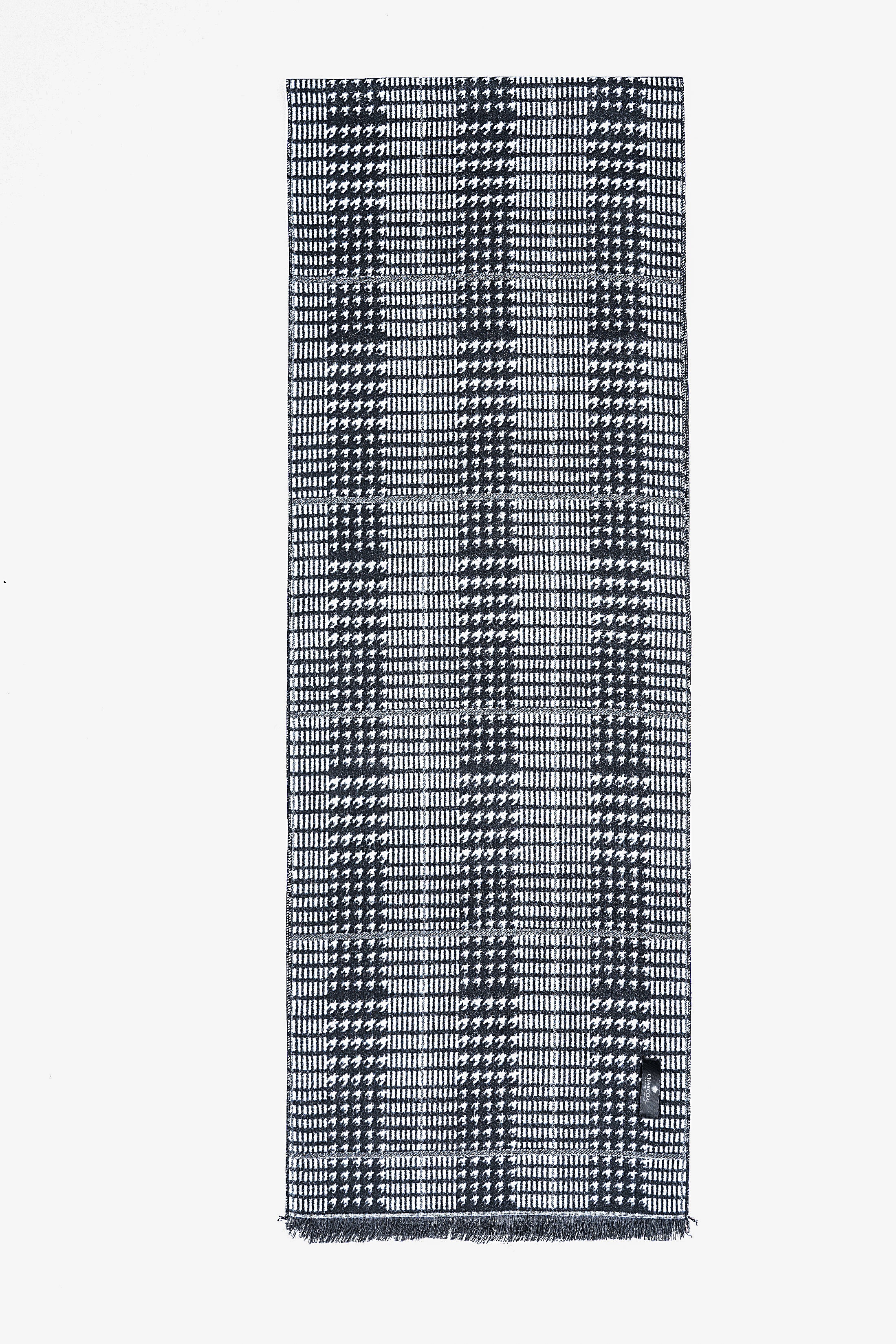 Dark grid houndstooth scarf with light highlights, neatly folded.
