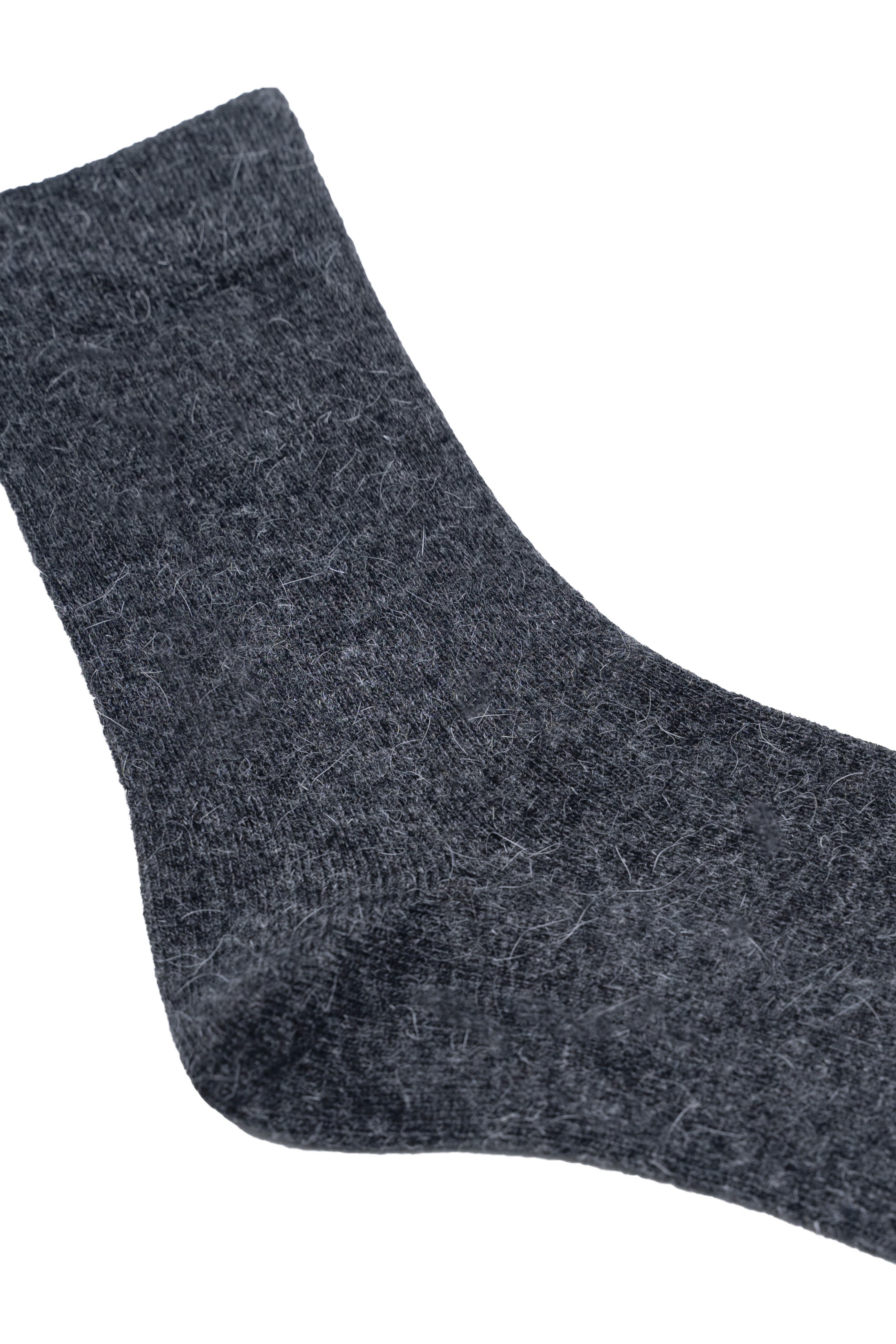 Dark gray wool sock close-up with textured knit fabric and toe seam