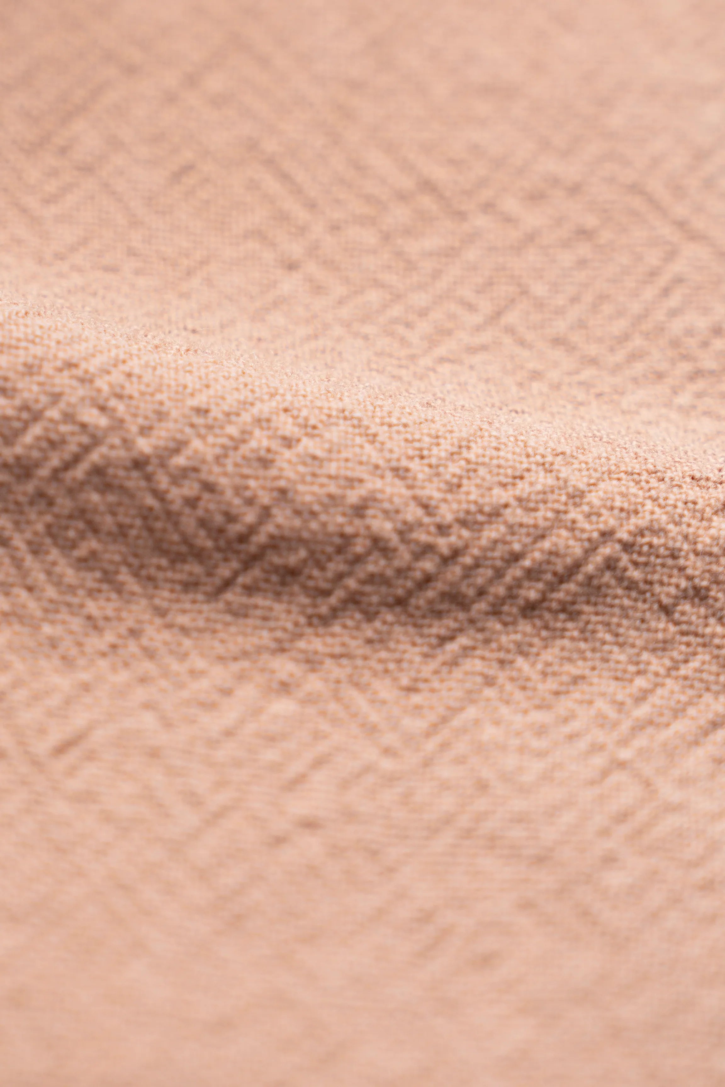 Brown dress shirt fabric close-up with fine woven texture and subtle heather pattern