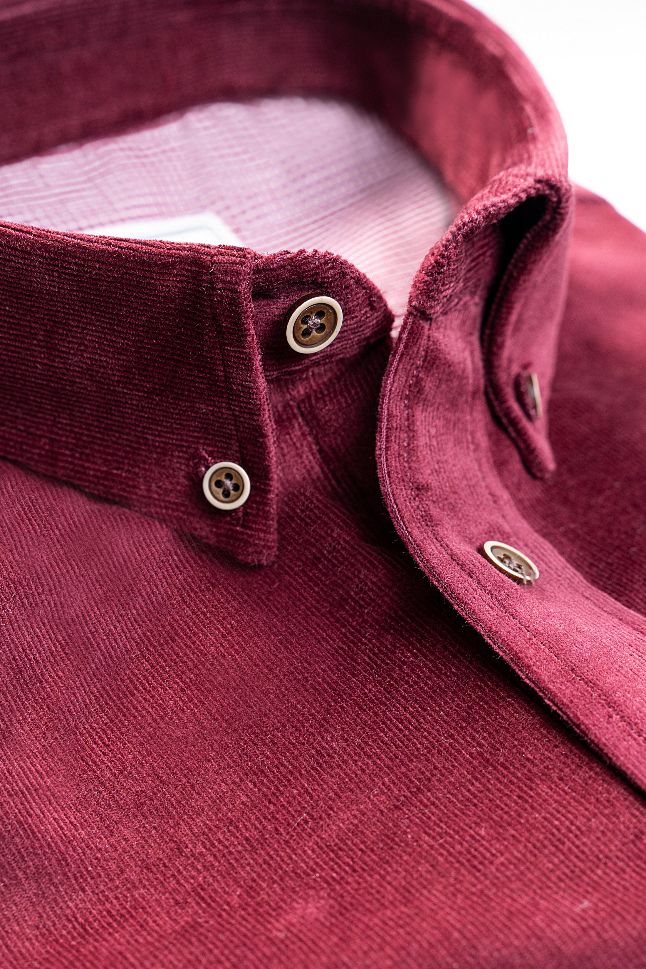 Wine red corduroy shirt with buttoned collar and placket detail