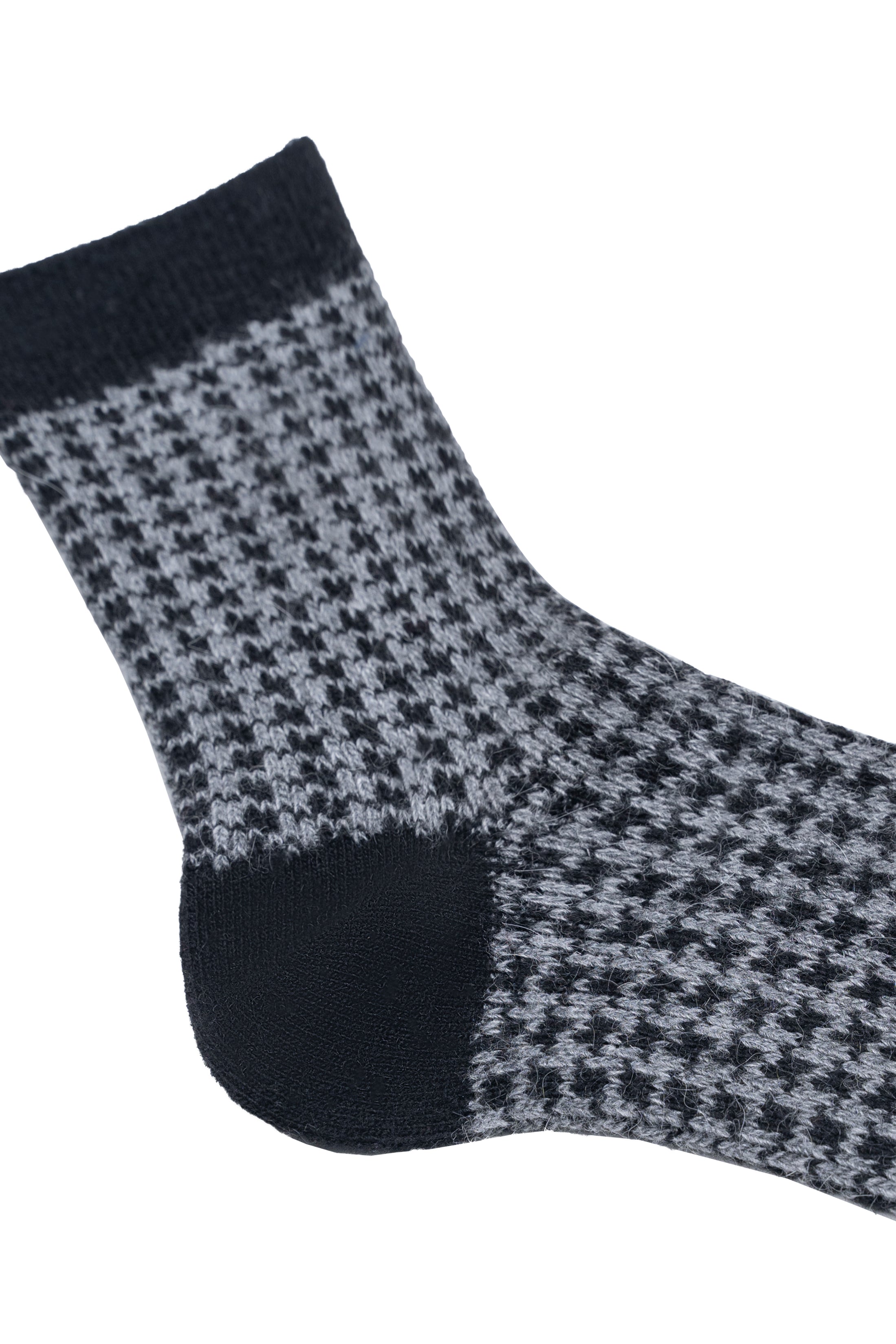 Wool sock with houndstooth knit on gray fabric and dark navy cuff