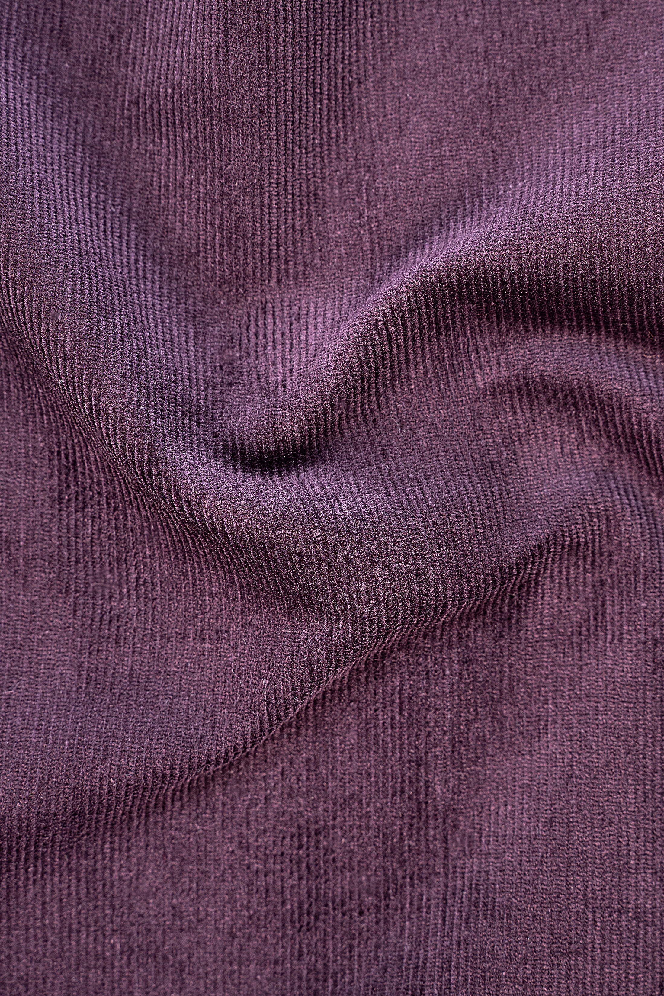 Corduroy fabric texture in dark plum