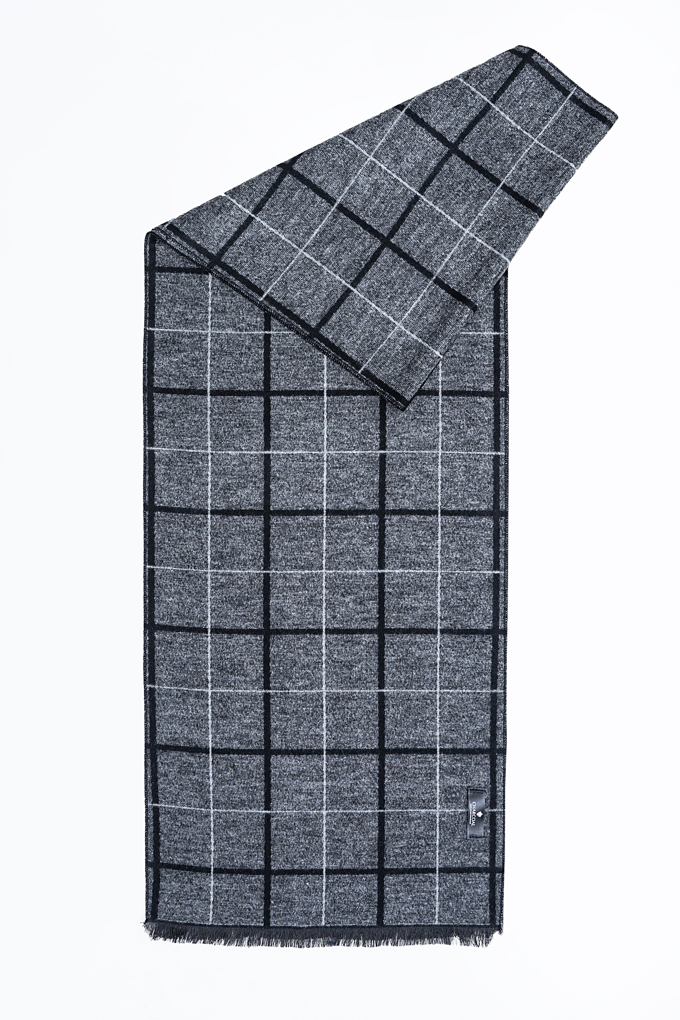 Gray plaid scarf with dark grid lines, fringed hem, draped folded style