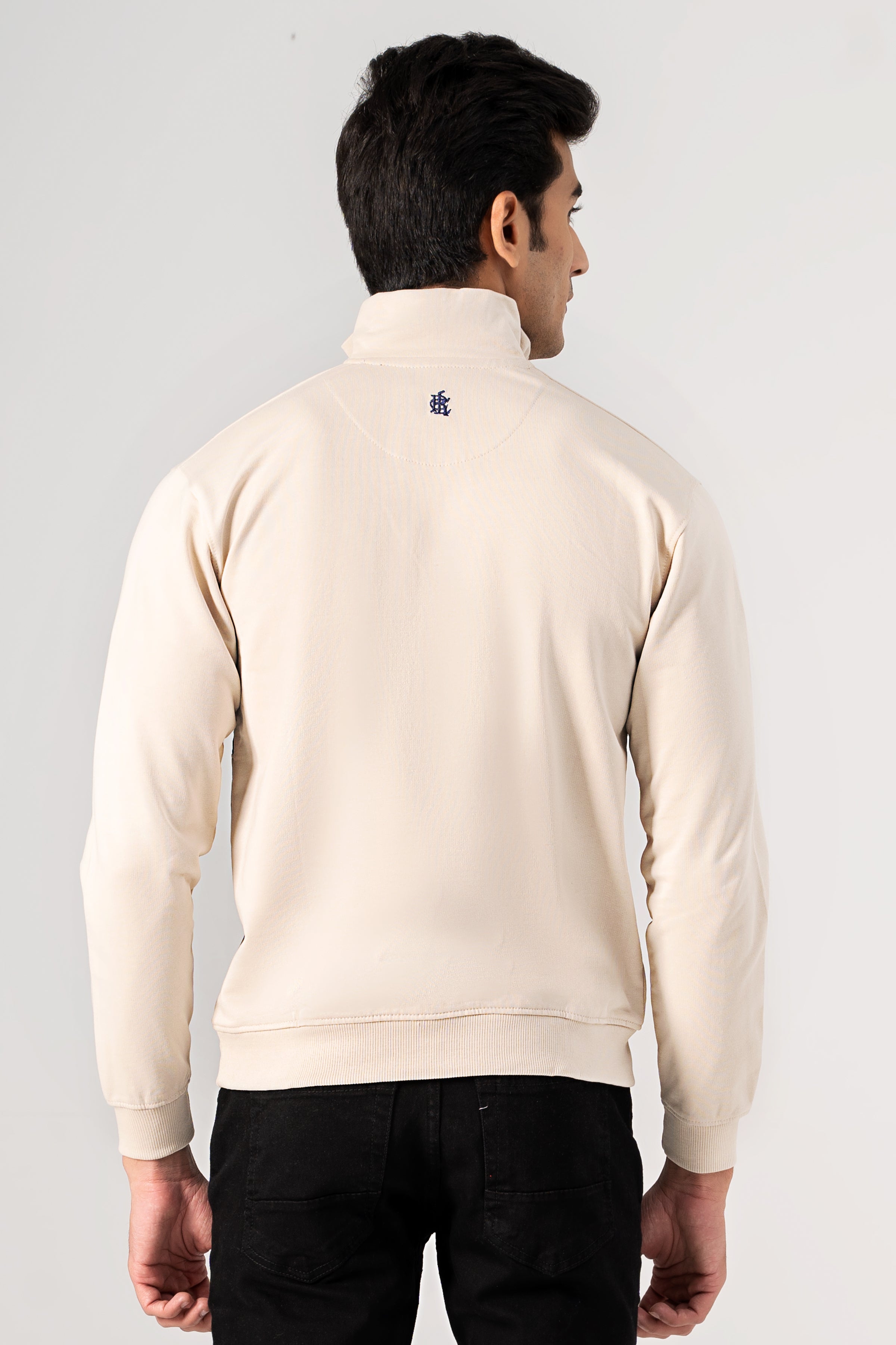 Beige mock neck quarter-zip sweatshirt, back view with small collar logo